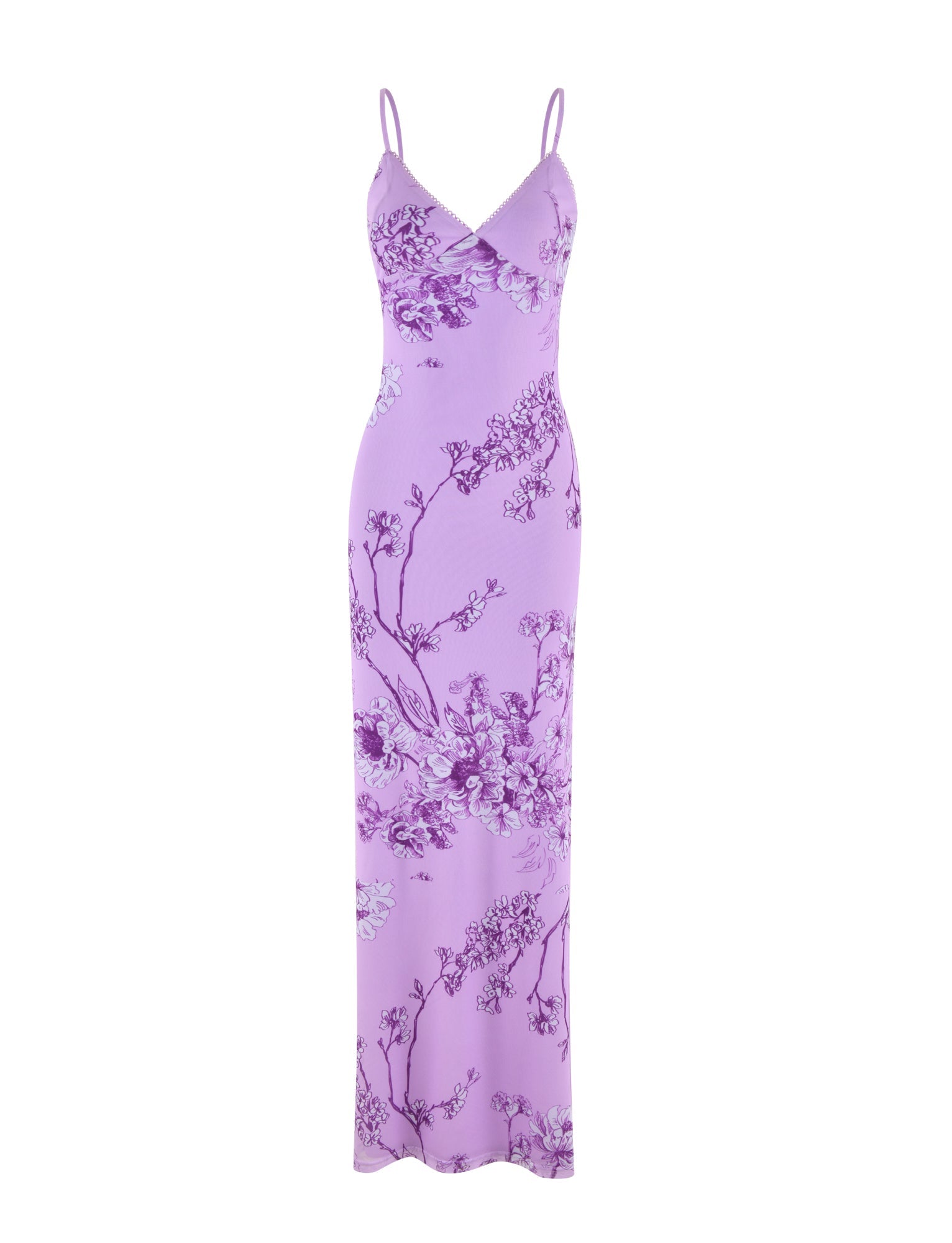 The JULIANNA DRESS by TIGERMIST is a sleeveless maxi dress with spaghetti straps, featuring a stunning purple ceramic floral print and a fitted design with a plunging neckline adorned with delicate purple and white blossoms.