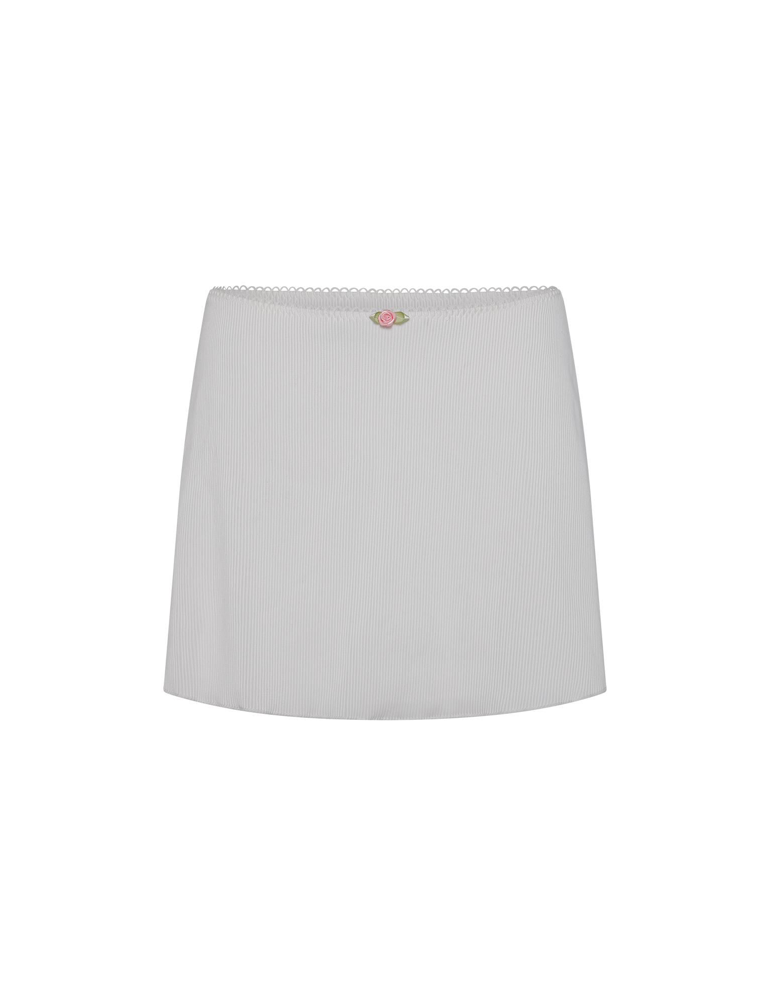 The MILANA SWIM SKIRT - WHITE by TIGERMIST is a mini skirt in plain white with a subtle ribbed texture, scalloped waistband, and a small pink and green floral embroidery at the front center.
