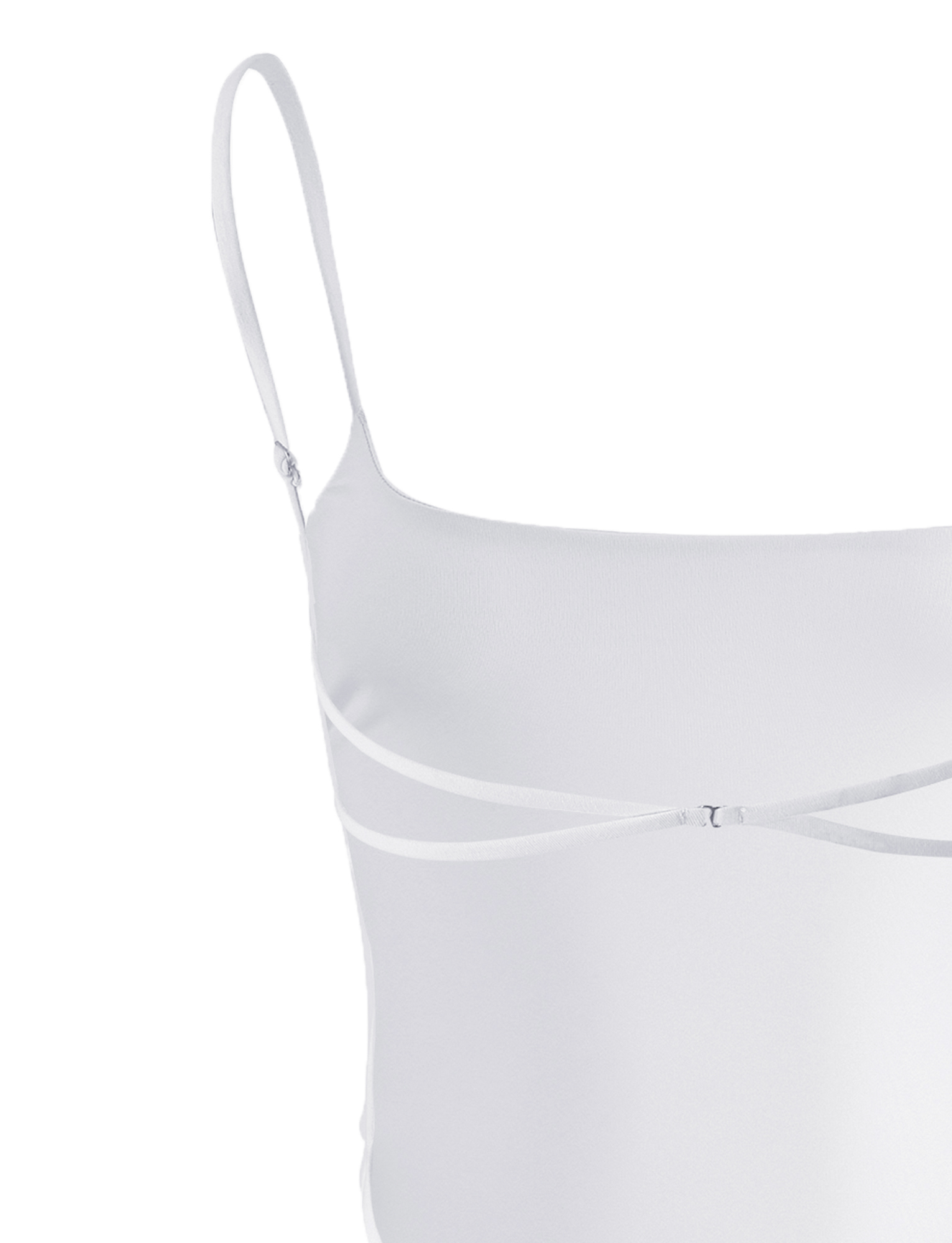 The MINERVA BODYSUIT - WHITE by TIGERMIST features spaghetti straps and two thin horizontal straps across the chest, creating a cut-out below the neckline. Its bodycon silhouette provides a smooth, fitted look.