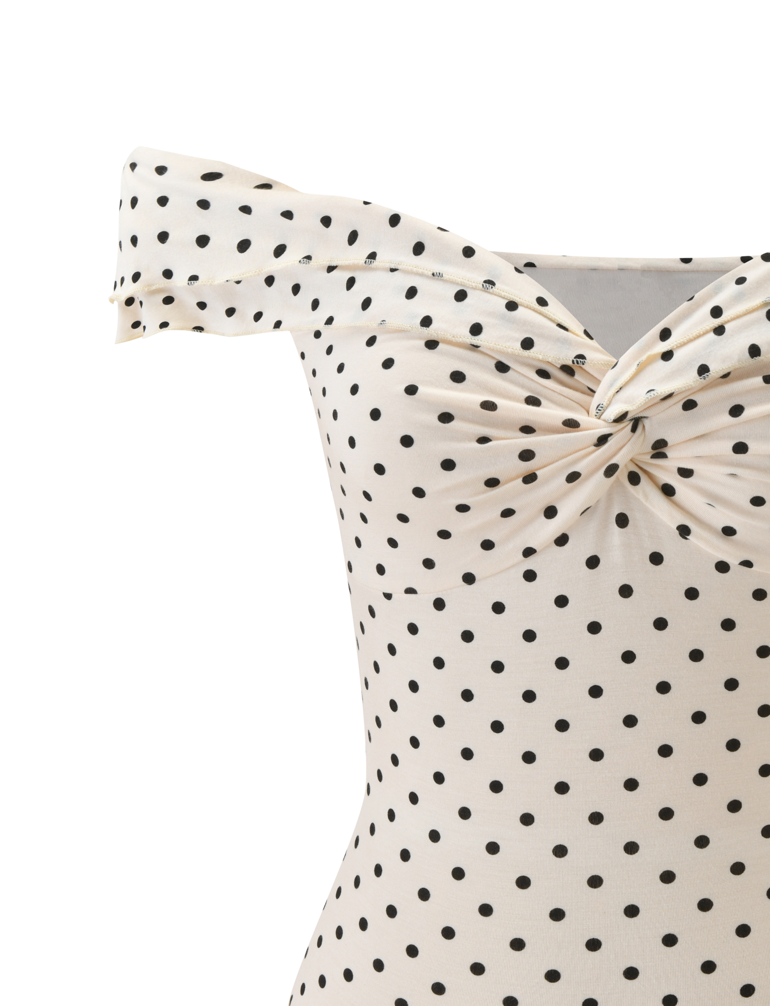 A close-up of the TIGERMIST DENALI TOP - CREAM DOT, an off-shoulder cream top with black polka dots and a twisted knot at the neckline.