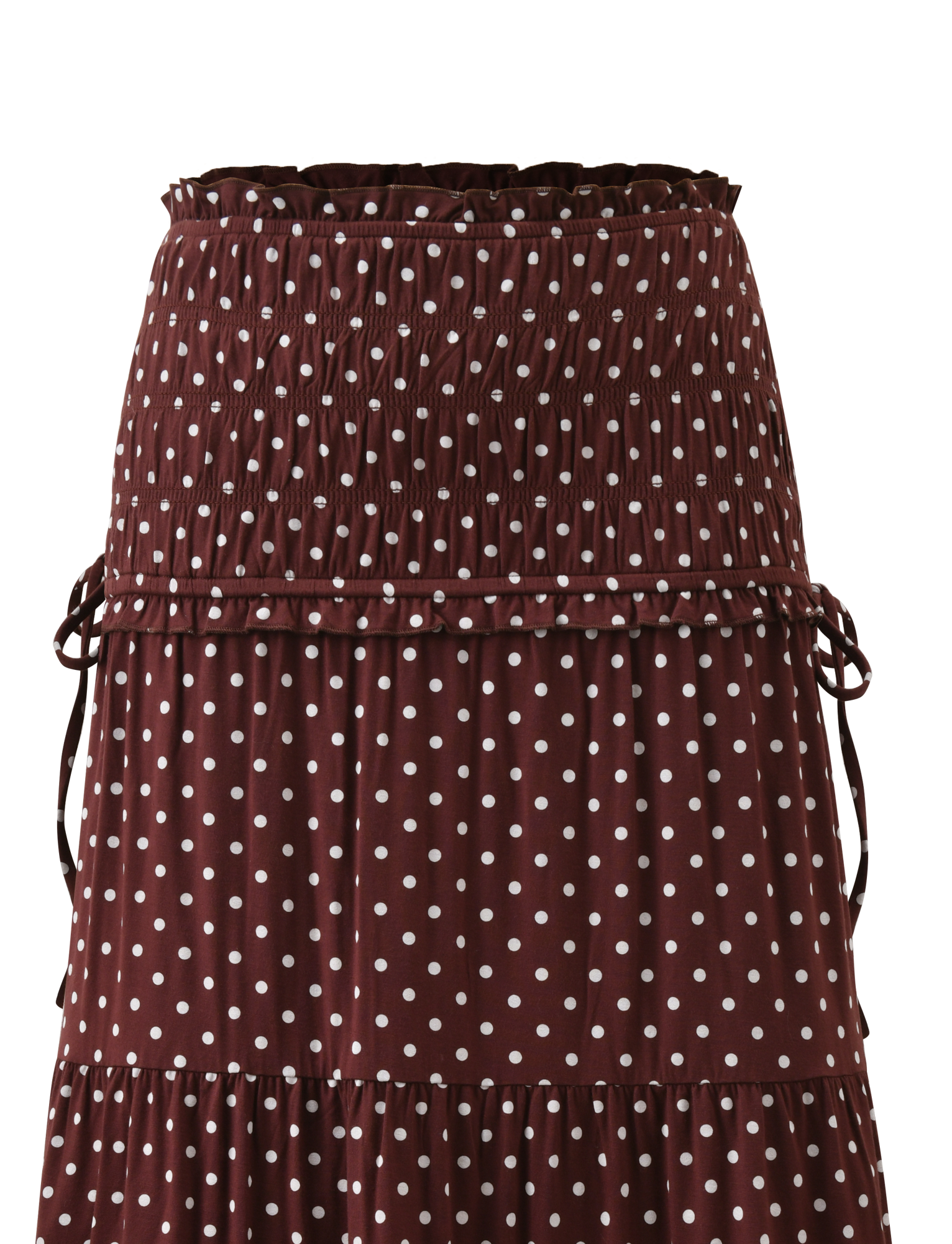 The DENALI MAXI SKIRT - BROWN DOT by TIGERMIST features white polka dots, a ruched waistband, tiered design, side ties, and soft modal fabric. Shown against a plain white background.