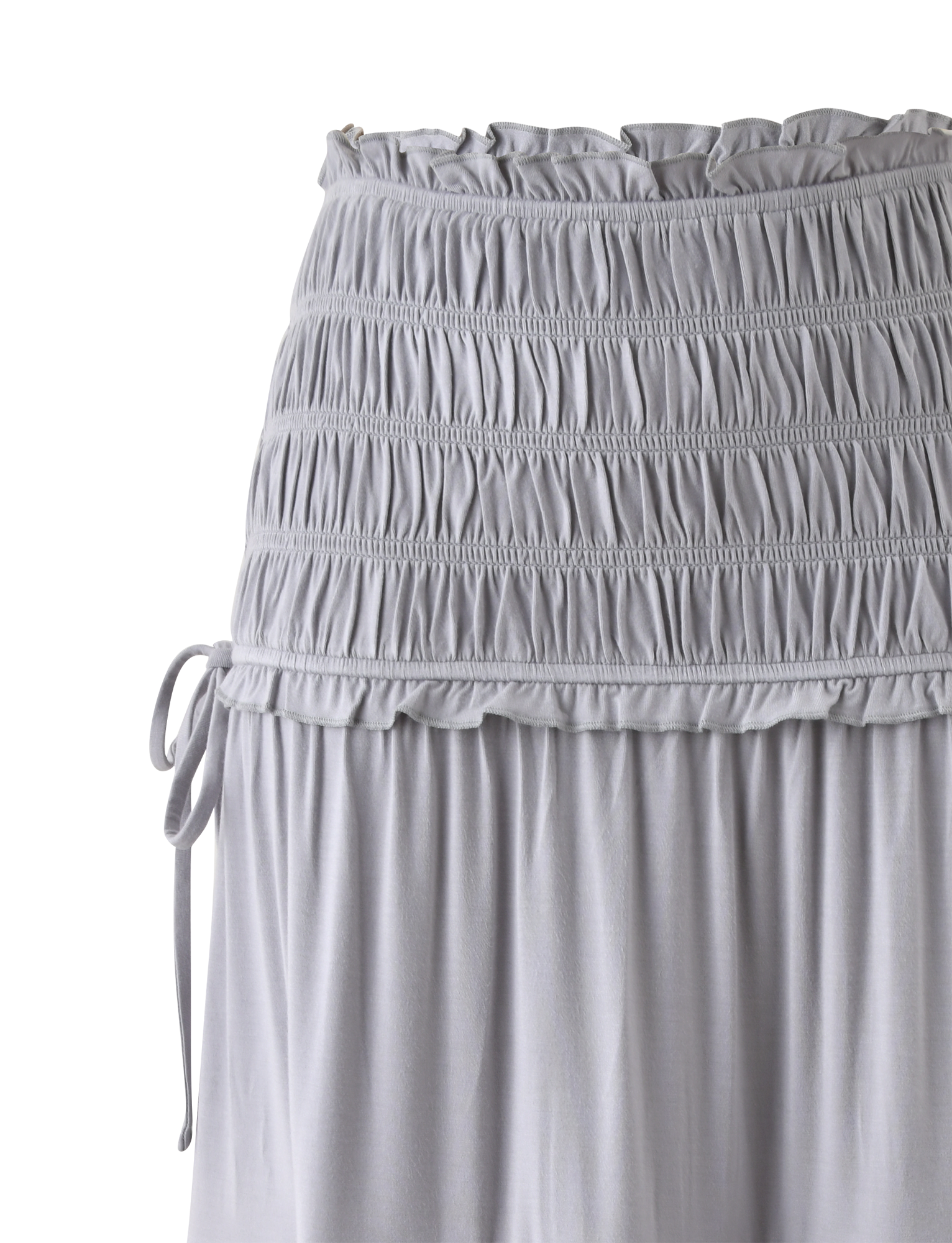 The DENALI MAXI SKIRT in Dove Grey by TIGERMIST features soft modal fabric, a shirred waistband with ruched stitching, side drawstring ties, and a lightweight, flowing fit for easy style.