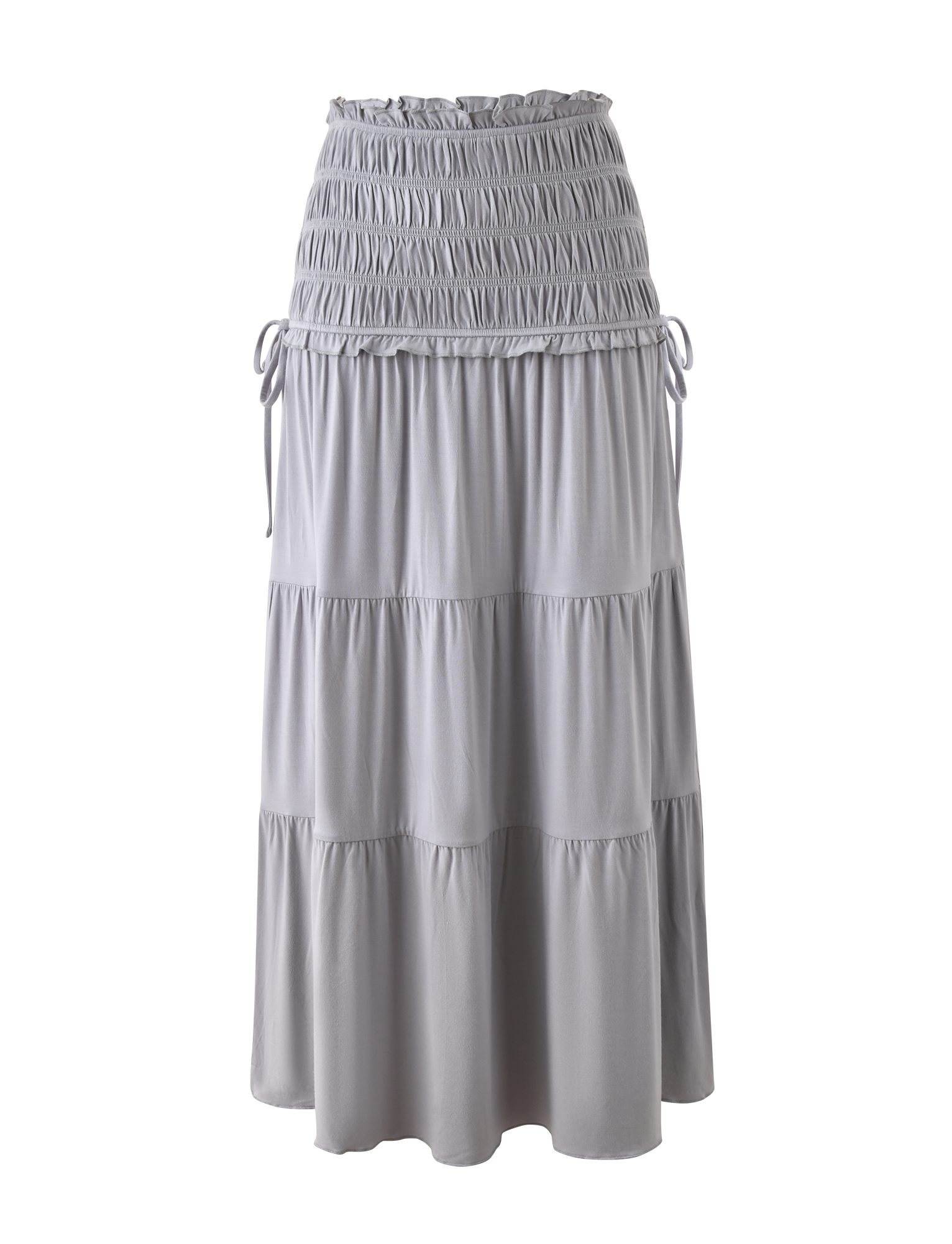 The TIGERMIST DENALI MAXI SKIRT in Dove Grey features soft modal fabric, a shirred elastic waistband with drawstring ties, and gathered, tiered layers for a flowy look. Shown against a plain white background.