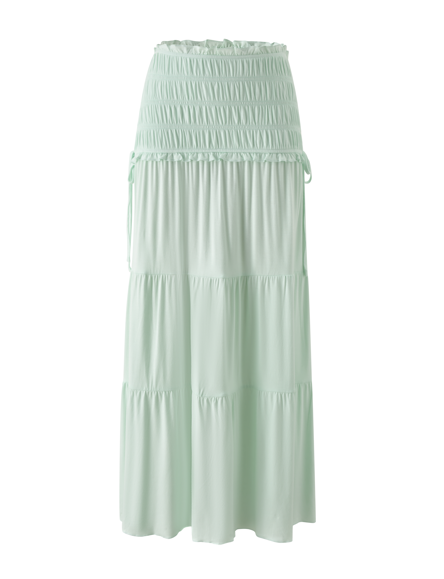 The DENALI MAXI SKIRT - SOFT MINT by TIGERMIST is a light mint green maxi skirt in soft modal, with a wide shirred waistband and adjustable side ties, shown against a plain white background.