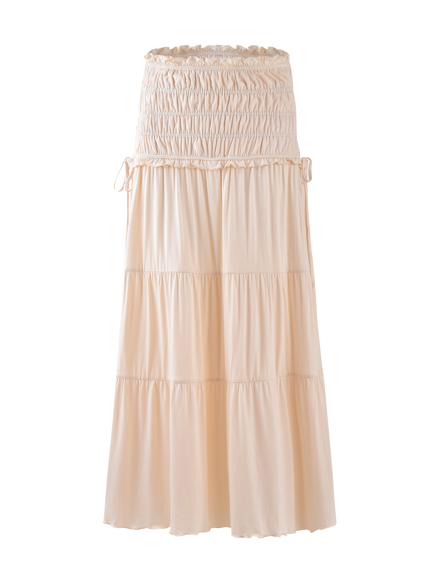 The DENALI MAXI SKIRT - NEUTRAL : BONE by TIGERMIST is a long, light beige jersey maxi skirt with a smocked elastic waistband and adjustable side ties, shown against a plain white background.