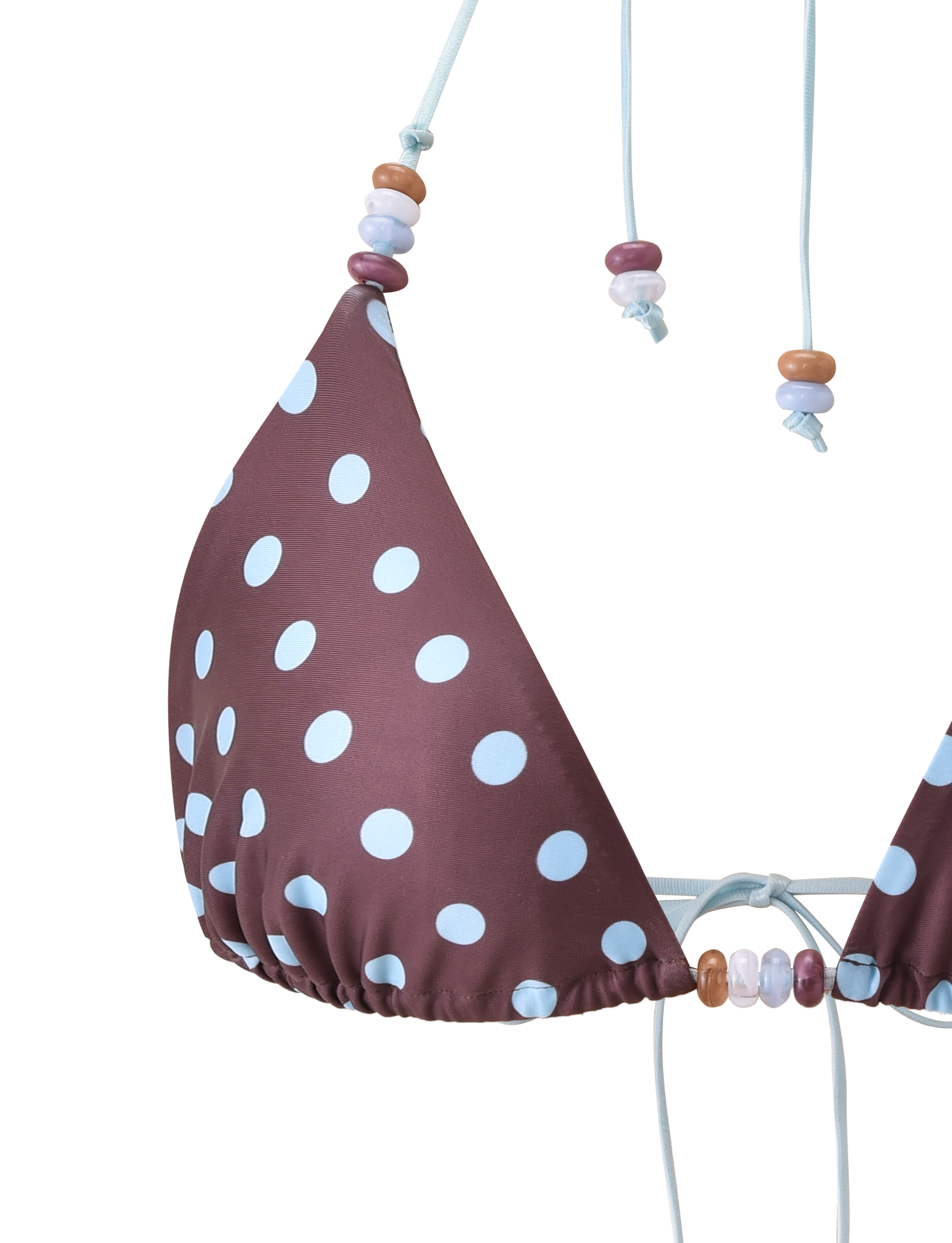 A close-up of the TIGERMIST FINLEA BIKINI TOP in brown and blue polka dot, featuring a triangle design with beaded strings, set against a white background.