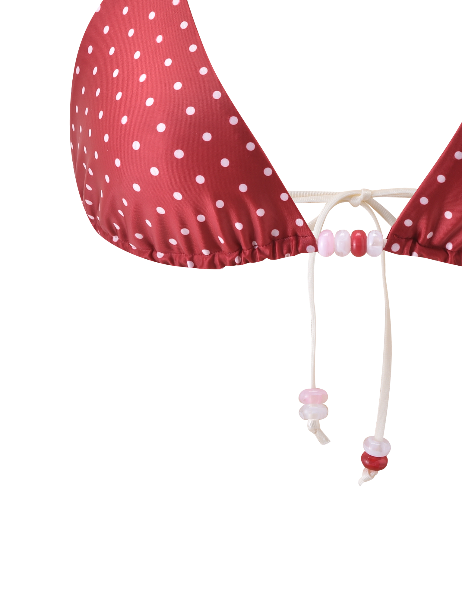 Close-up of the TIGERMIST FINLEA BIKINI TOP in red and cream polka dot, featuring a triangle design with white string ties and pink, white, and red beads on the ends, set against a plain background.