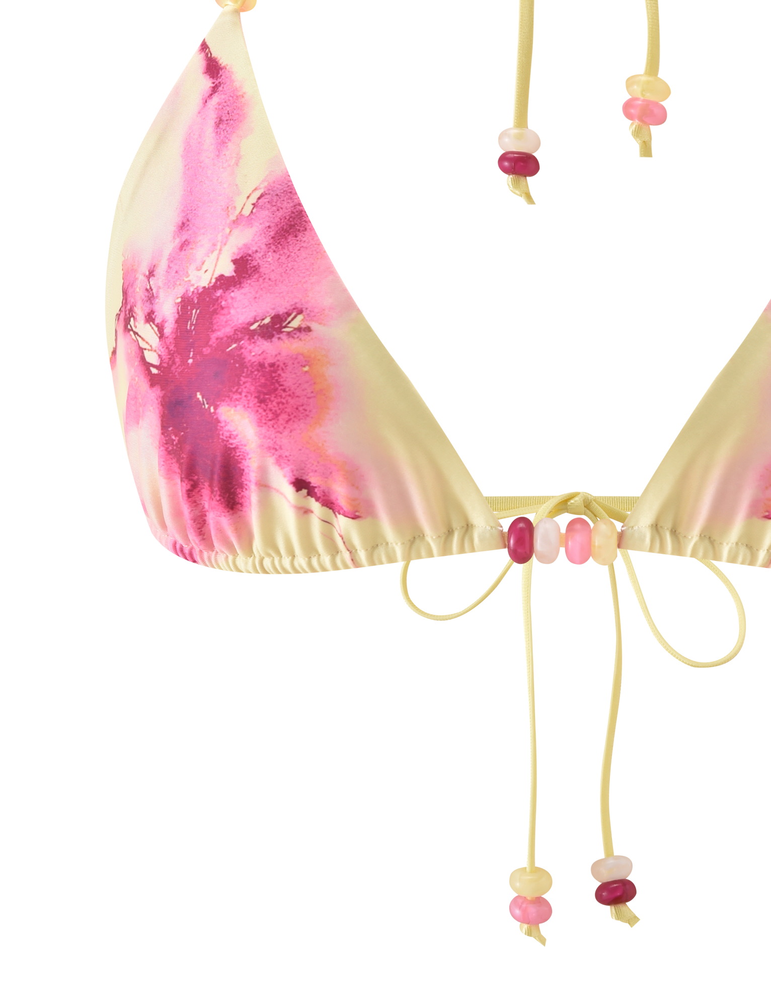 Close-up of the FINLEA BIKINI TOP - WATERCOLOUR FLORAL by TIGERMIST. Features a yellow and pink tie-dye pattern, adjustable halter neck, and beaded strings in pink, yellow, and white. Set against a plain white background.