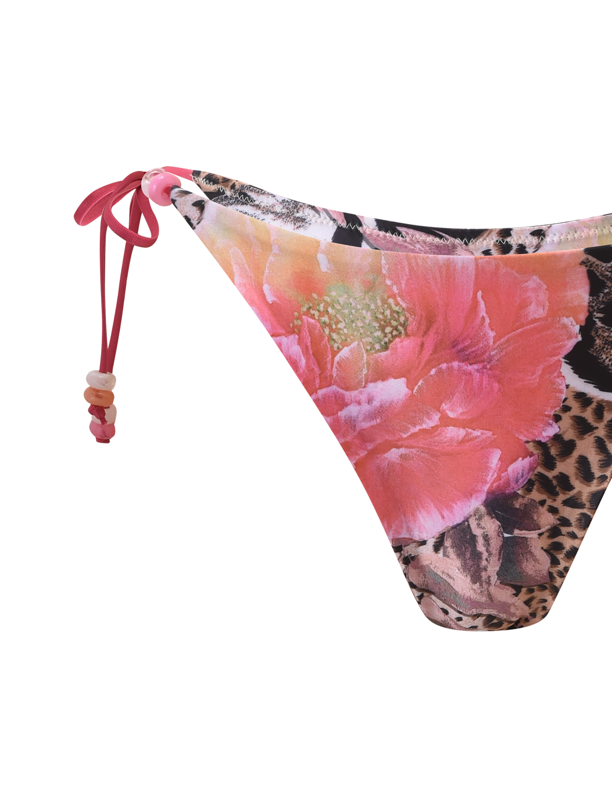 A close-up of the TIGERMIST FINLEA BIKINI BOTTOM - ANIMALIER FLORAL shows its vibrant floral animal print, pink string tie, and decorative beads on the side, set against a white background.