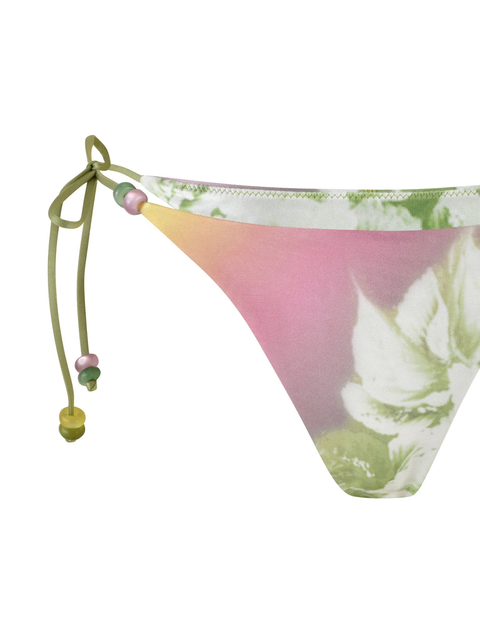 A close-up of the FINLEA BIKINI BOTTOM - GREEN : FLORAL : STRIPE from TIGERMIST showcases a pastel gradient with shades of pink, yellow, and green, accented by a delicate white floral pattern. The elastane bikini brief features adjustable side straps adorned with multi-colored beads.