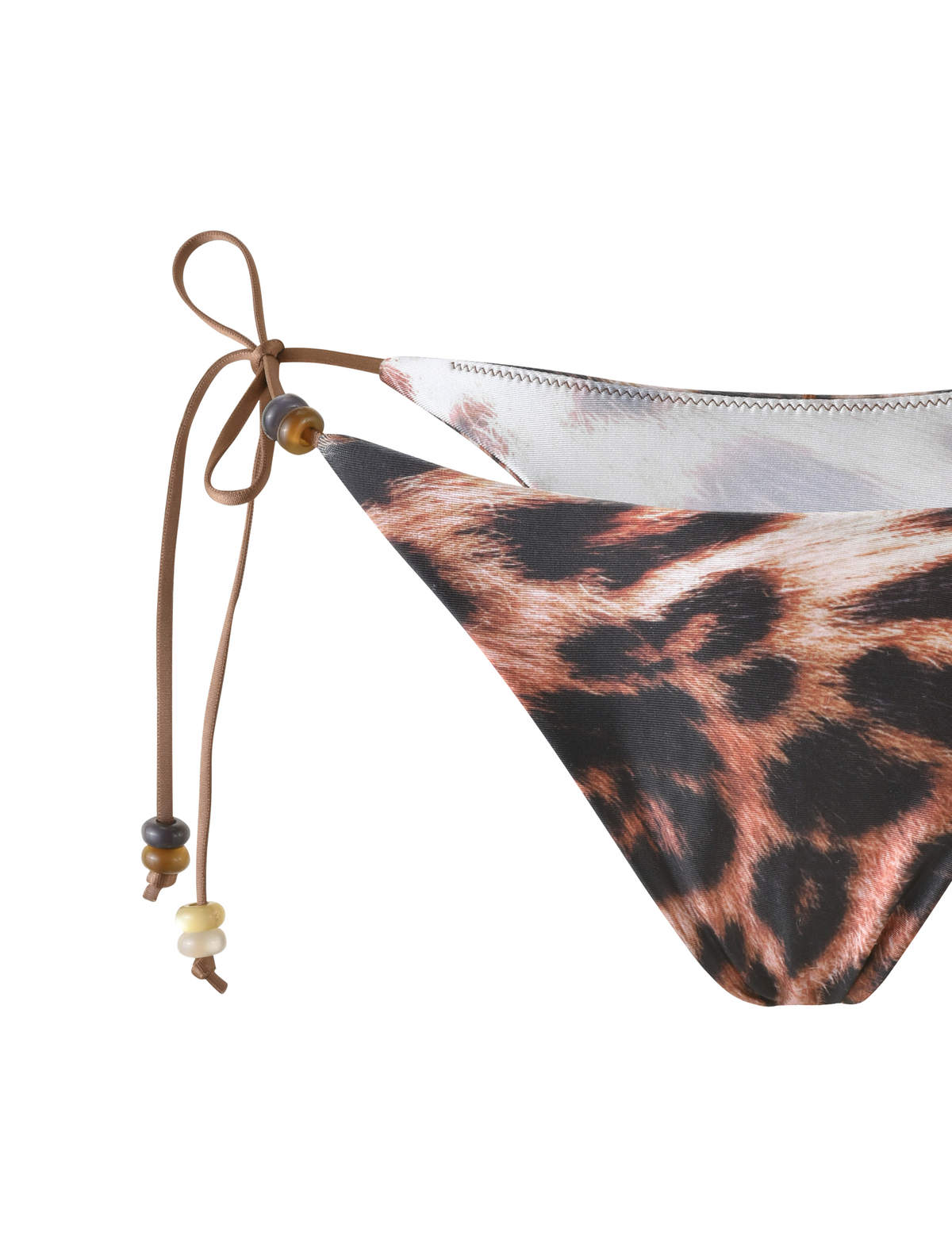 Close-up of the TIGERMIST FINLEA BIKINI BOTTOM in Leopard Haze, a cheeky bikini cut with brown string ties and bead accents on the left side.