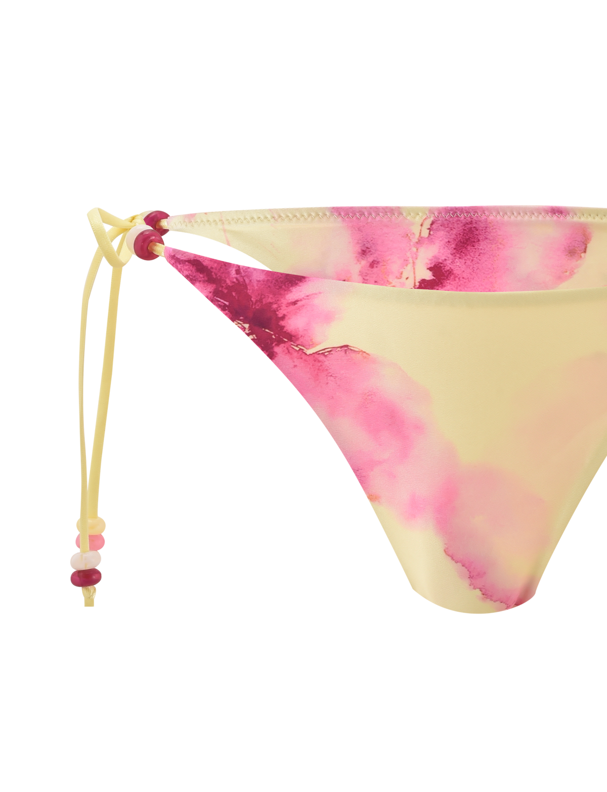 The FINLEA BIKINI BOTTOM - WATERCOLOUR FLORAL by TIGERMIST features a cheeky yellow design with pink watercolor patterns and a side tie, finished with pink and red beads.