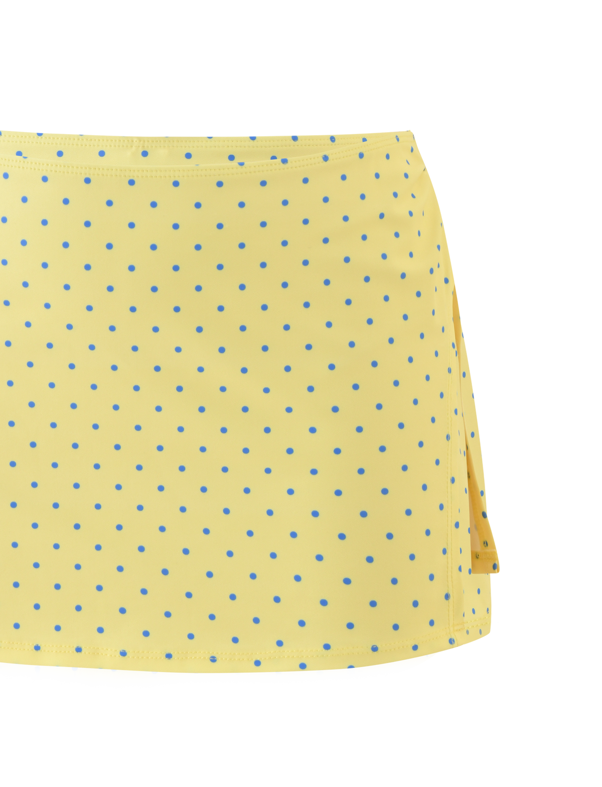 A close-up of the TIGERMIST DIANA SWIM SKIRT SET in Lemon and Blueberry Spot, showcasing yellow fabric with blue polka dots and a right side slit against a white background.