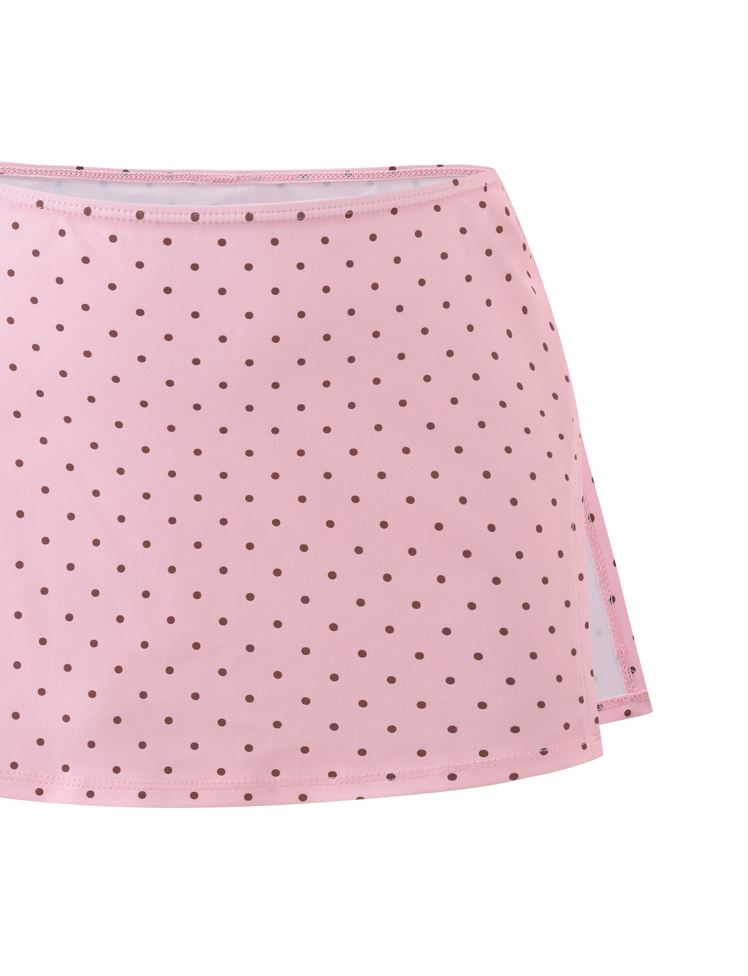 The TIGERMIST DIANA SWIM SKIRT SET in pink polka dot features a side slit and a pattern of small brown dots on a white background.