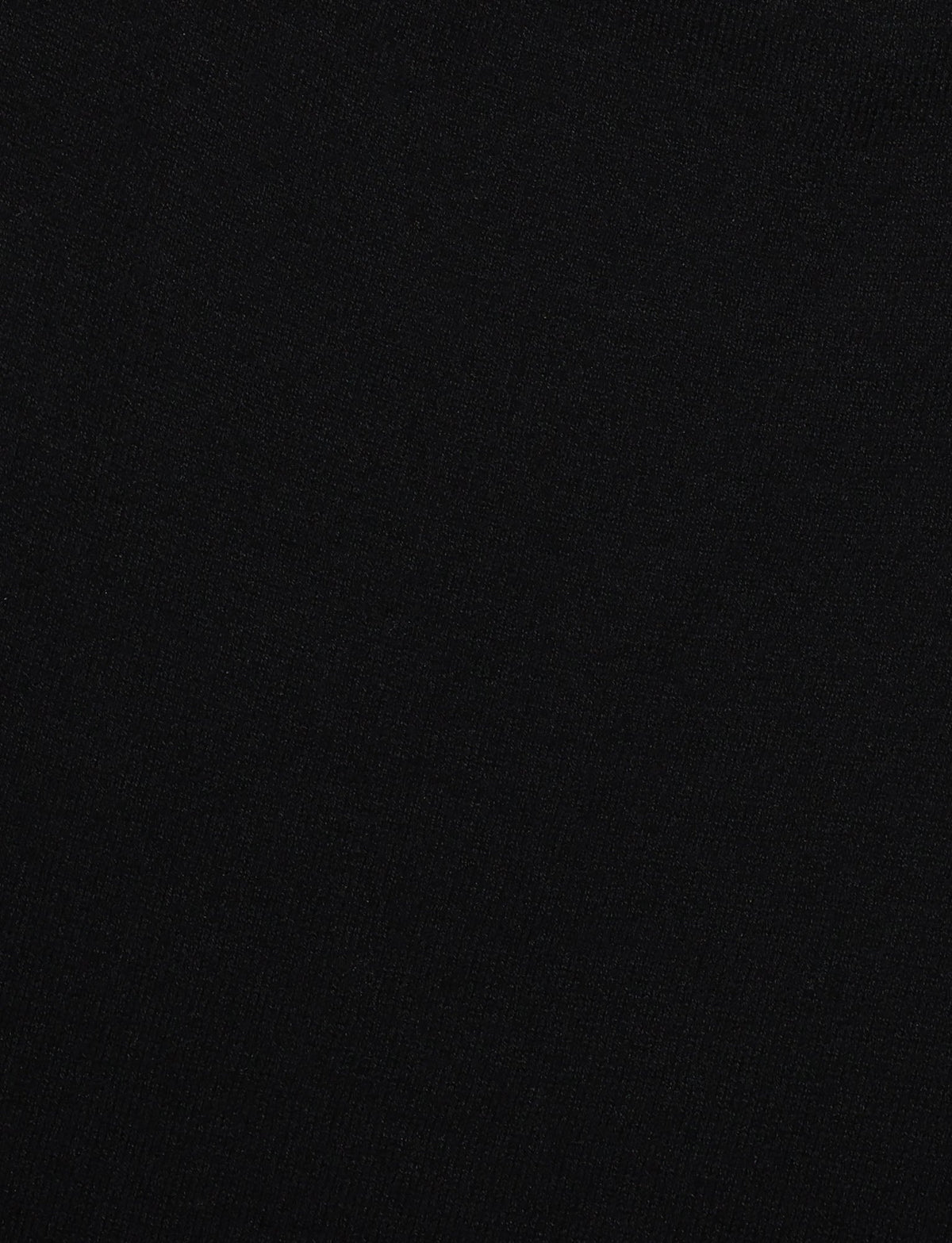 A solid black surface with a smooth, uniform texture reminiscent of the DIEDRE Jumper Dress by TIGERMIST in knit fabrication. The image is entirely filled with the color black, without any visible patterns or variations.