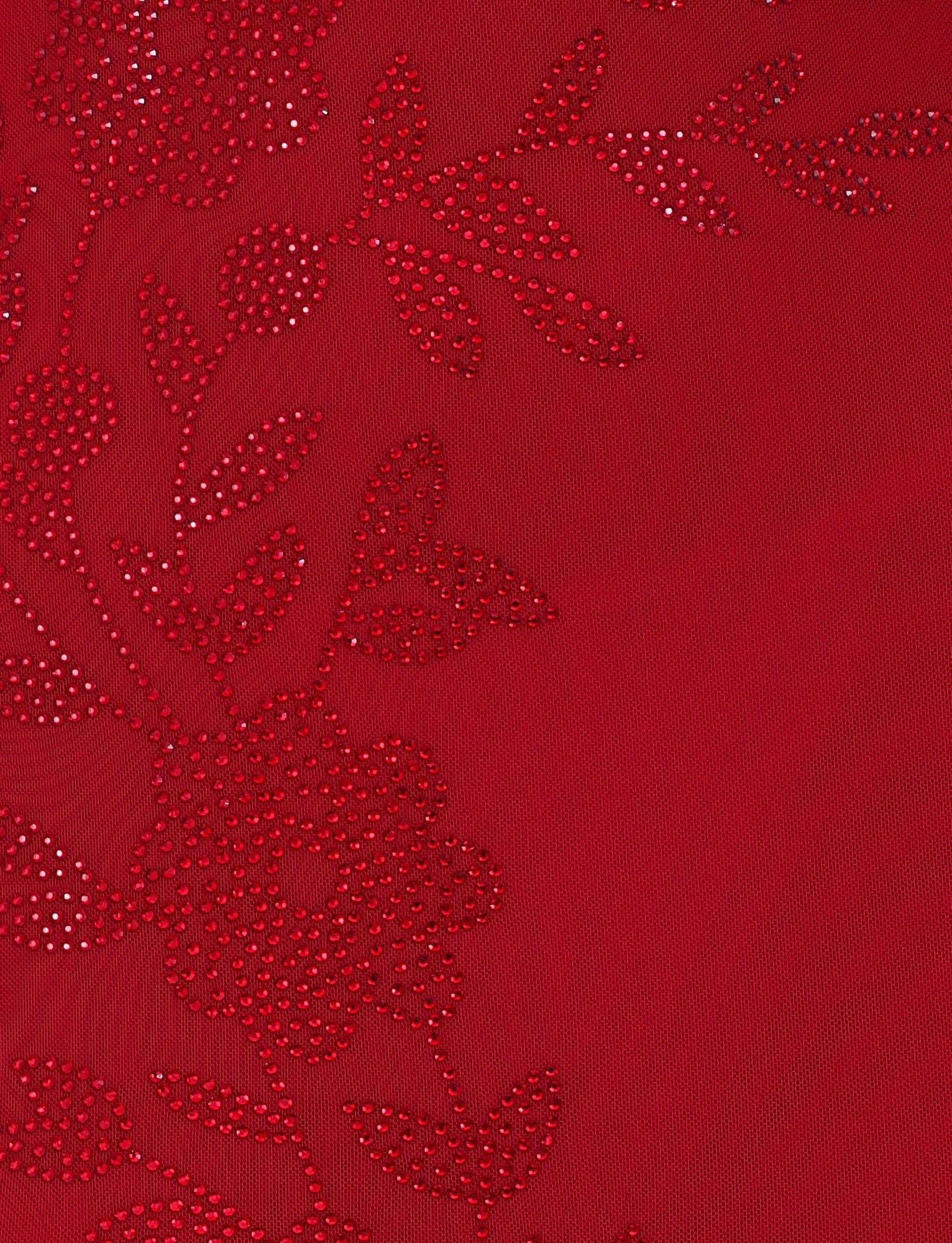 A close-up of the Cherry Red fabric from the TigerMist Octavia Maxi Dress highlights its detailed floral pattern, adorned with small round metallic studs arranged in floral and leaf shapes. This design enhances the texture and decorative appeal of this exquisite maxi-length dress.