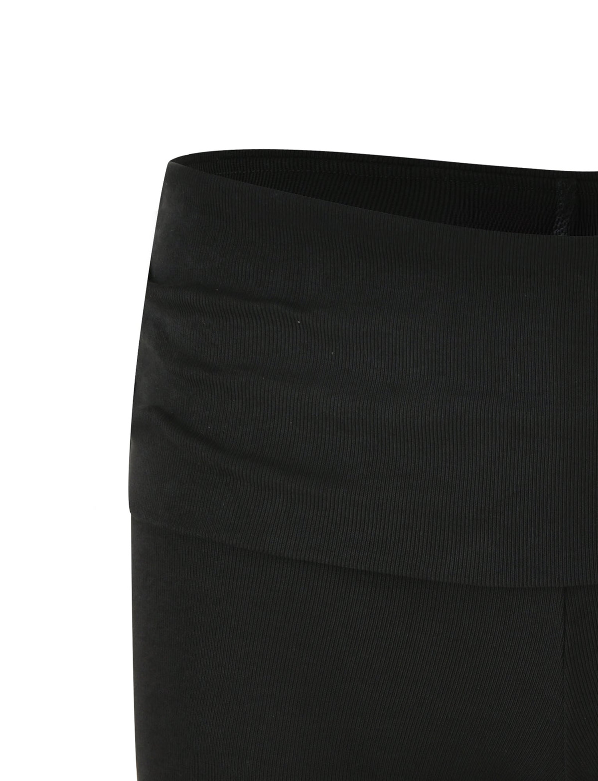 Close-up view of the waistband and upper part of TIGERMIST's KARINA RIB SHORT - BLACK leggings. The fabric appears to be stretchy, with a smooth, ribbed texture, and the waistband is designed to sit high on the waist. No visible patterns or logos are present on these leggings.