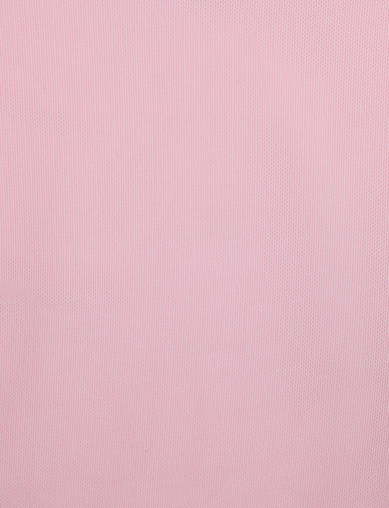 A close-up view of a light pink textured fabric, showcasing a subtle grid-like pattern across its surface. The texture appears soft and even, reminiscent of the TIGERMIST COVE DRESS - PINK : BABY PINK with its ruched detailing and consistent color throughout.