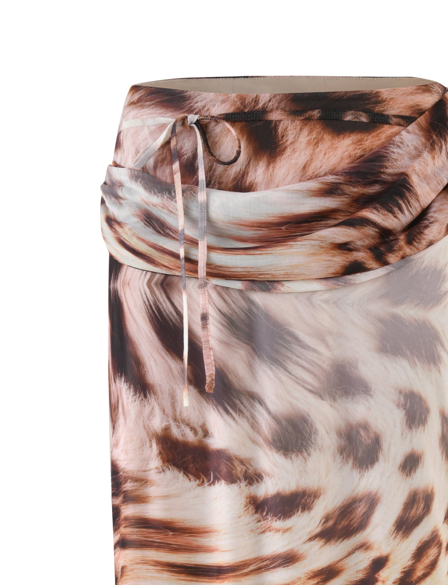 A close-up of the TIGERMIST Pearl Maxi Skirt - Neutral: Leopard: Leopard Haze highlights its relaxed silhouette in a sheer fabric adorned with an animal pattern in shades of brown, beige, and black. This leopard colorway enhances the design, featuring a side tie that drapes elegantly over the material.