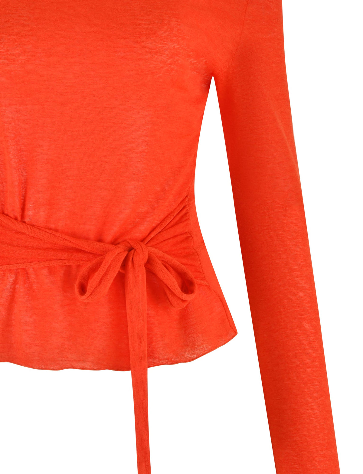 Close-up of a red long-sleeve top by TIGERMIST named the BRYNA JUMPER, featuring a waist tie detail. The fabric appears soft and slightly sheer, with a gathered and tied section at the waist creating a cinched effect, showcasing its adjustable styling.