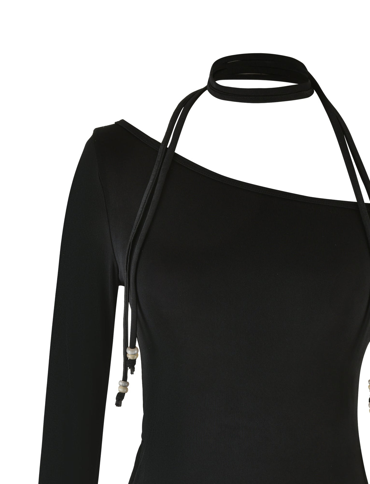 The MIETTA TOP - BLACK by TIGERMIST is a black, long-sleeve top with an asymmetrical neckline and a thin halter strap. Made from high stretch fabric, it fits smoothly and drapes elegantly from the left shoulder to the right underarm. The multi-tie neck strap loops around stylishly, adding a chic element.