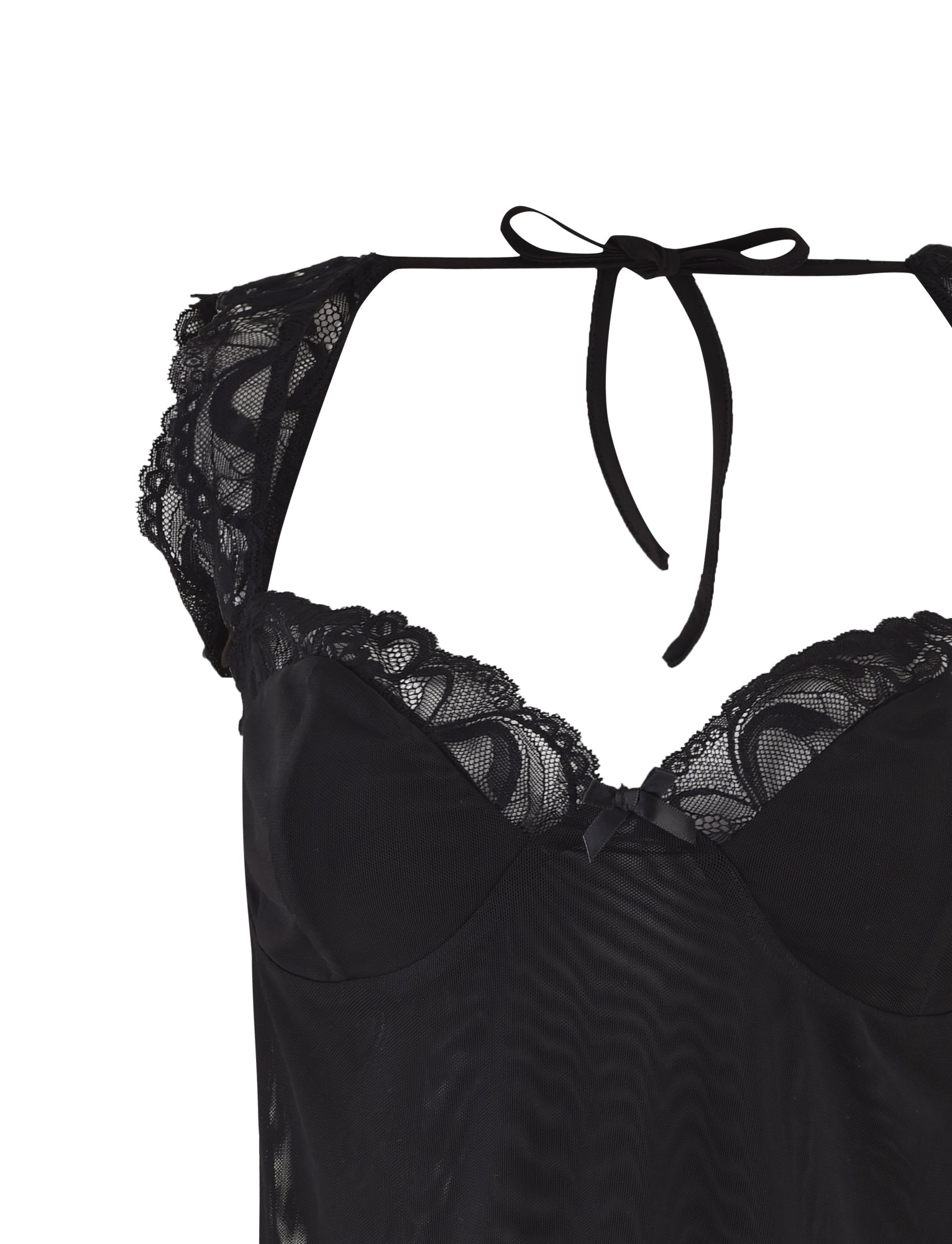 The NYOMI TOP - BLACK by TIGERMIST showcases a captivating open back design with a ribbon tie closure at the neck. This black lace top is adorned with delicate lace detailing around the cups and shoulders, while a sheer lace panel adds an extra touch of allure. The fabric feels soft and smooth against the skin, enhancing its appeal.