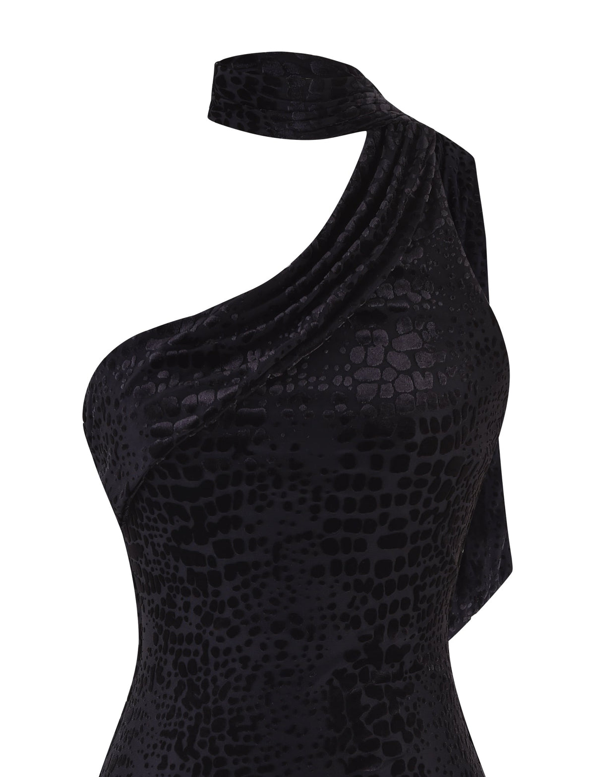 A close-up of the TIGERMIST ALLIRA BURNOUT MINI DRESS 2.0 in black, a one-shoulder dress that showcases a textured, snake-skin-like pattern. The dress elegantly drapes over the shoulder with a velvet burnout finish, offering an exquisite and sophisticated appearance.