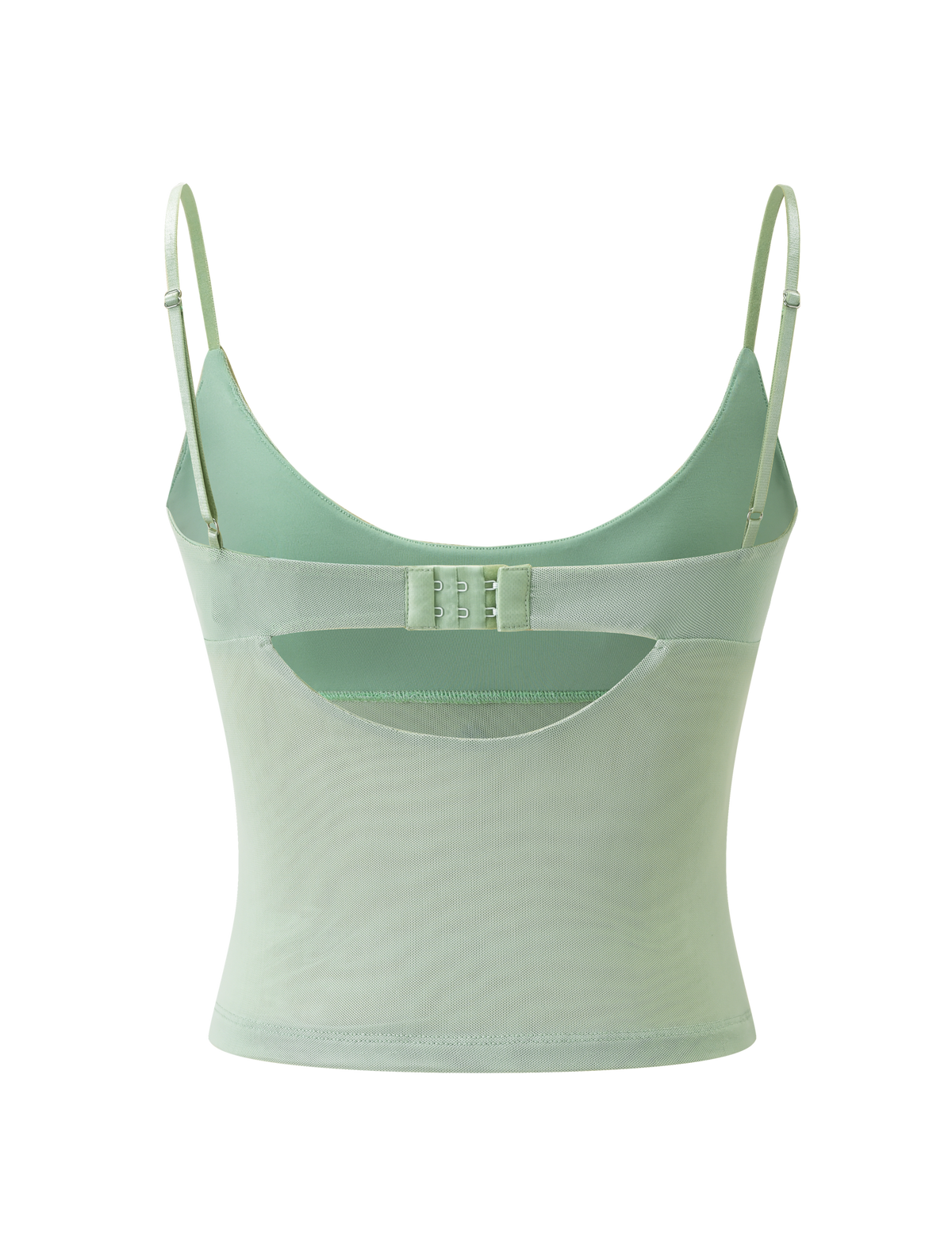 The OCTAVIA TOP - PISTACHIO by TIGERMIST is a pastel green mesh camisole with adjustable straps, scoop back, hook-and-eye closure, fitted semi-sheer design, and delicate floral embellishments.