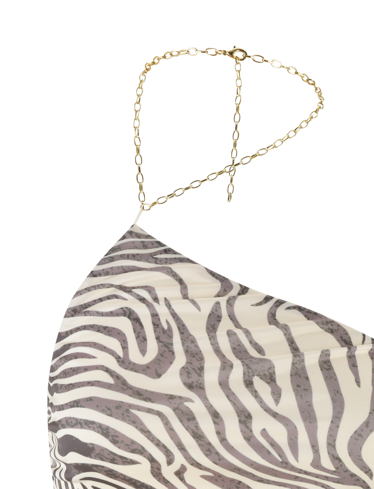 A close-up of the TIGERMIST LYRA TOP - NEUTRAL : ZEBRA, a cropped zebra-print top featuring a thin gold chain strap draped over the shoulder.