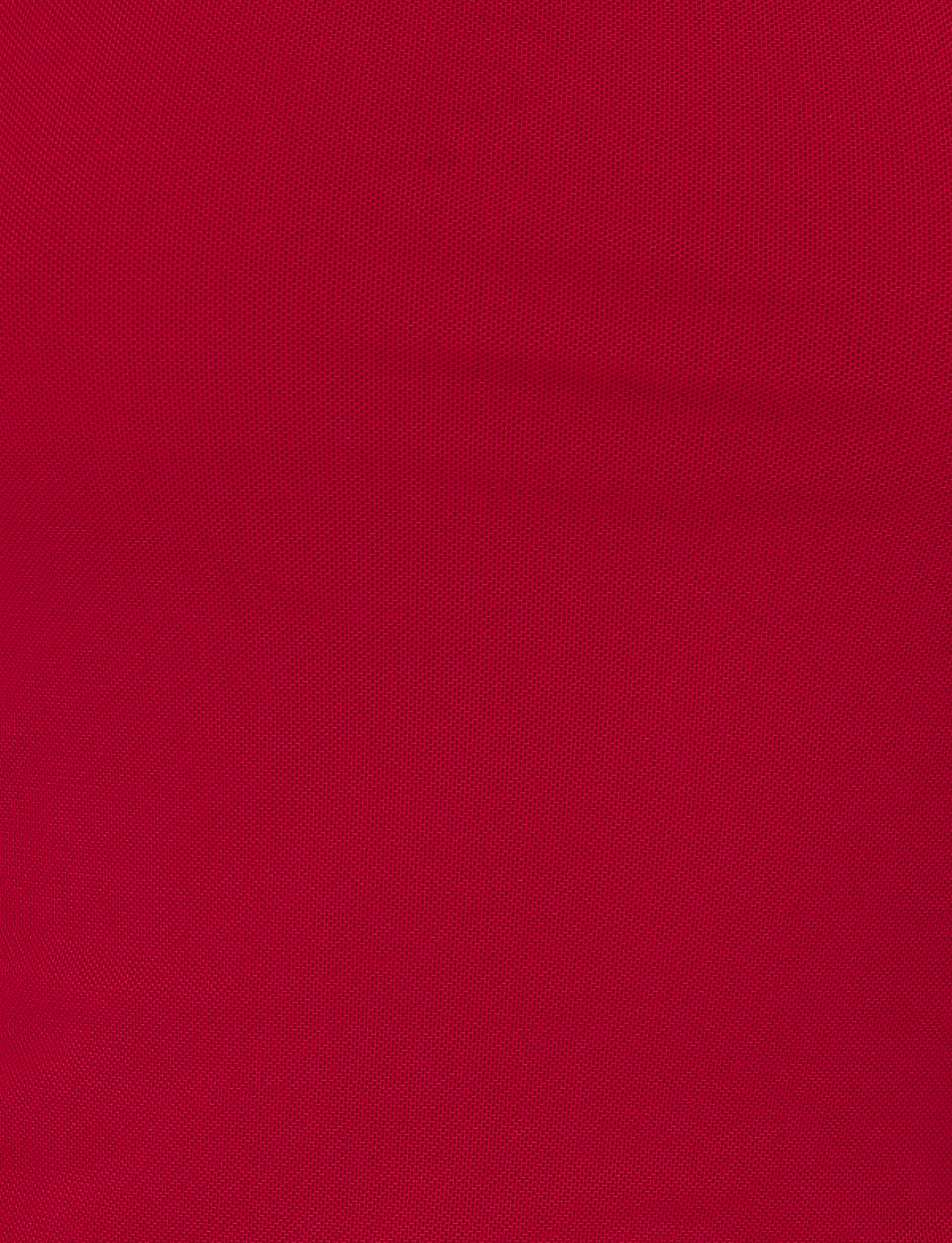 Close-up of the FIONA TOP in red by TIGERMIST, showing its textured fabric with a subtle diamond or mesh pattern, evenly lit and filling the frame.