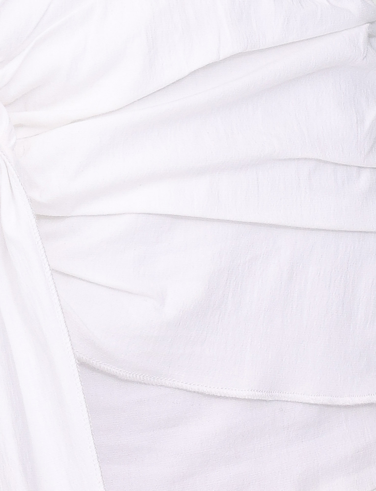 Close-up of the ZADIE SHIRT DRESS in white by TIGERMIST, featuring lightweight cotton poplin with gathered, ruched details and visible seams for soft folds and a layered texture.