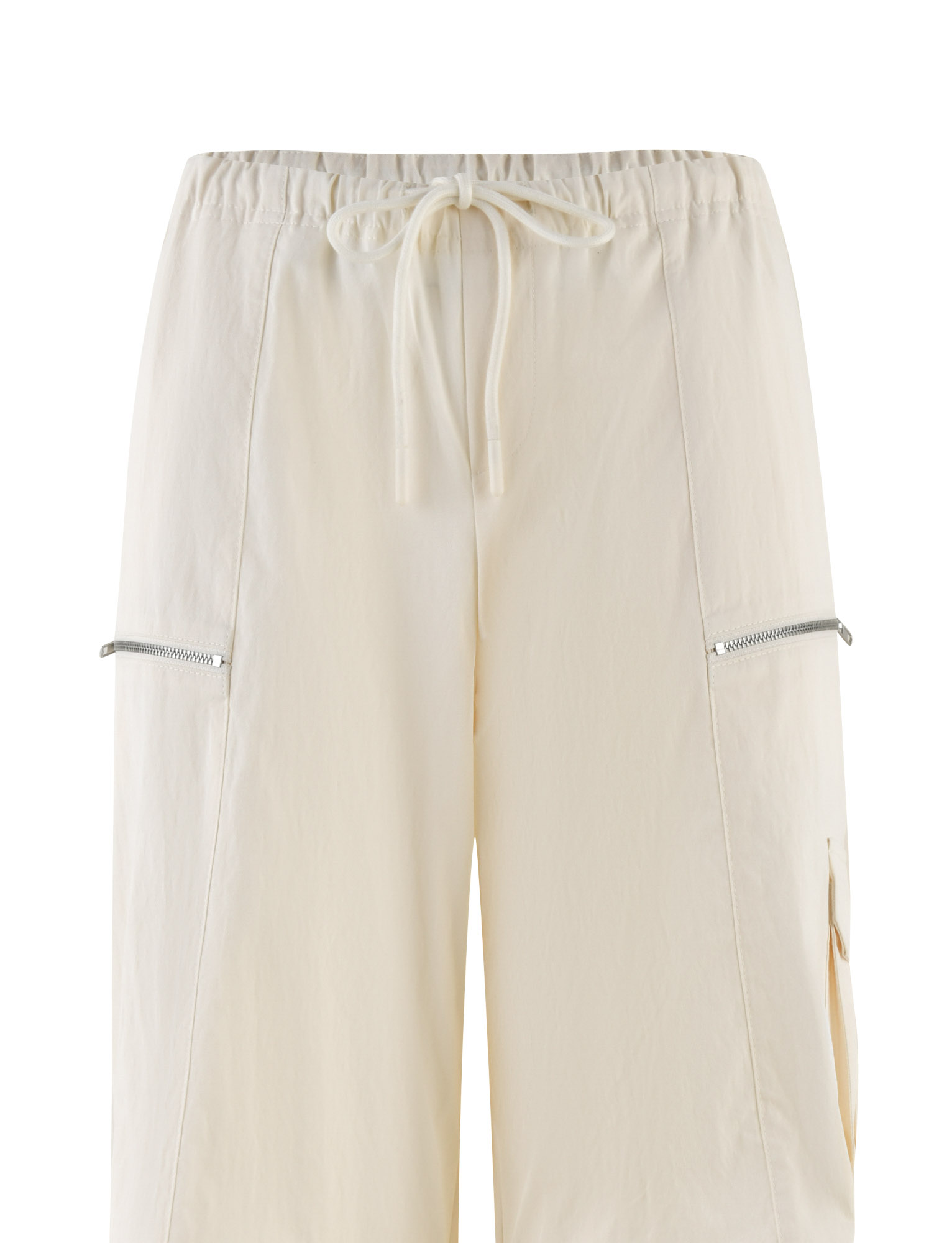 The TIGERMIST HERMIONE PANT - YELLOW: BUTTER: SOFT BUTTER are low rise cargo pants with a drawstring waist, visible thigh zippers, and a handy side pocket.