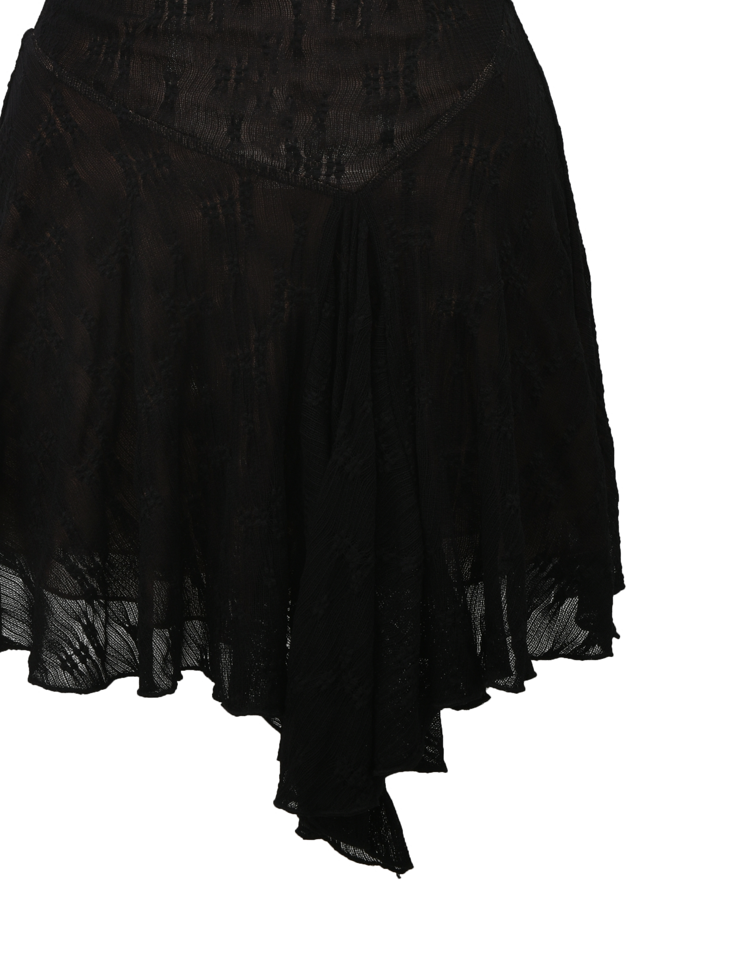 A close-up of the TIGERMIST FIORELLA DRESS in black lace, featuring a semi-sheer, asymmetrical ruffle design with a handkerchief hem and intricate lace details, set against a white background.