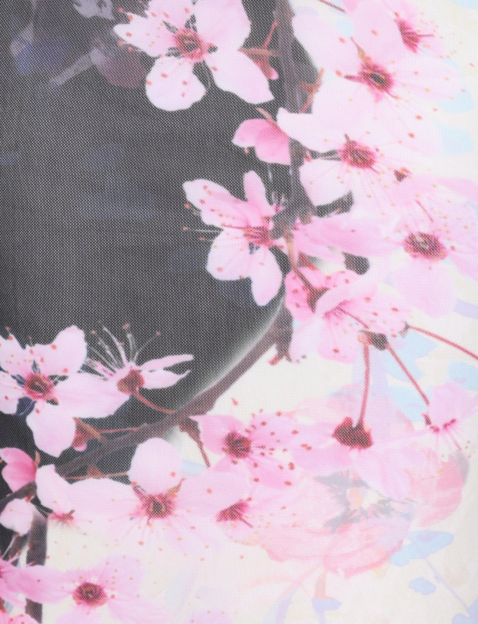 Close-up of the TIGERMIST LILLIAN MAXI DRESS in Multi, featuring a cherry blossom floral print with pink flowers and brown branches over a light base, finished with a fine transparent mesh overlay.