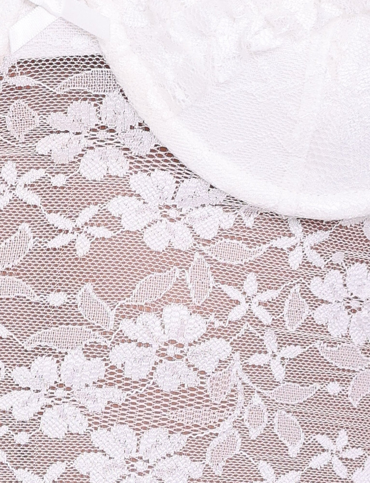 Close-up of the NYRA TOP - WHITE by TIGERMIST, a white lace bustier with sheer mesh, delicate floral embroidery, and sheer shoulder strap detailing.