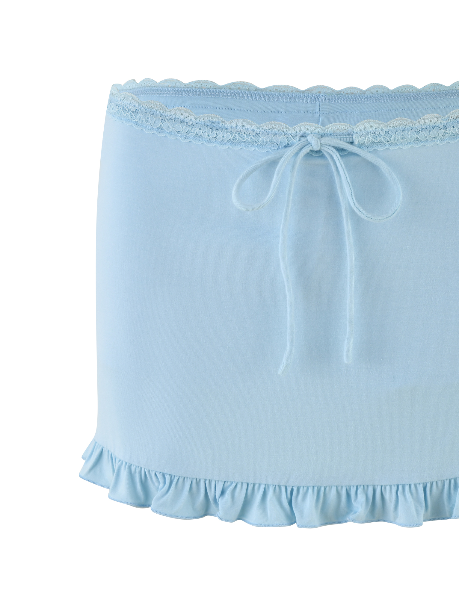 The TIGERMIST MELLIE SKORT in Baby Blue features tonal lace at the waist, a center bow, and a ruffled hem. Made from soft, stretchy jersey, this mini skort offers a delicate and feminine look.