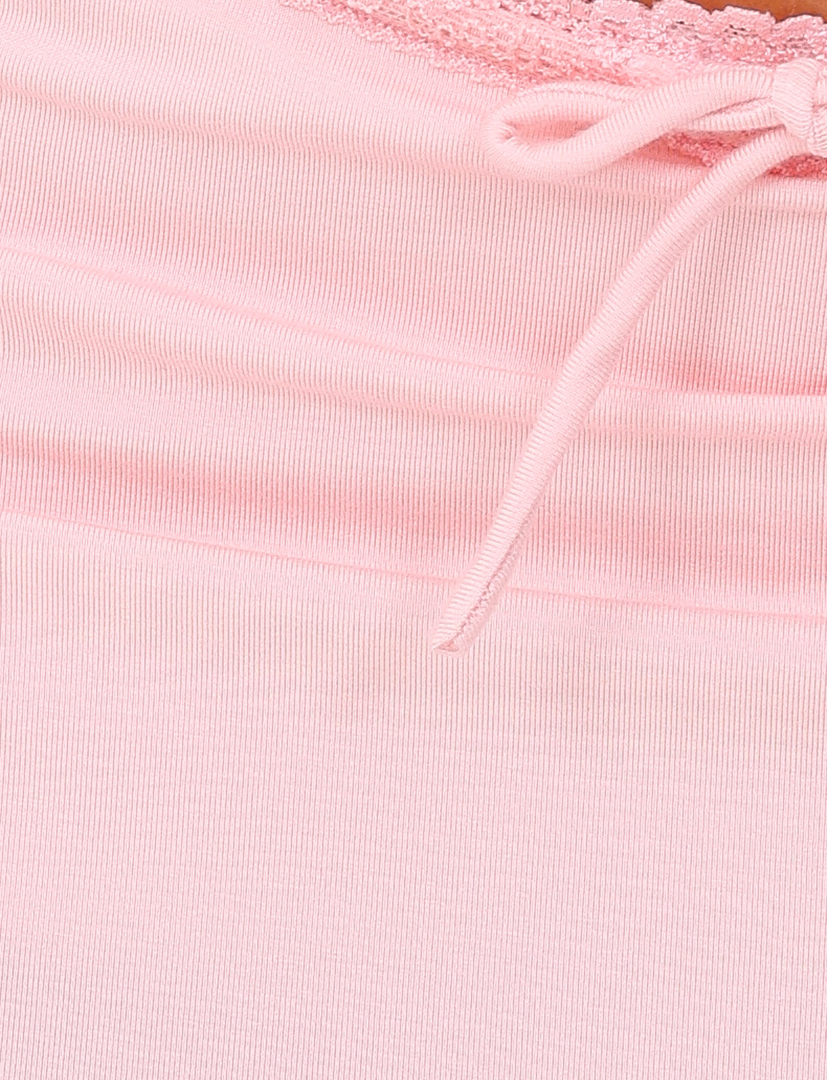 Close-up of the MIRELLE SKORT in pastel pink by TIGERMIST, featuring light pink ribbed fabric with lace trim and a small bow.