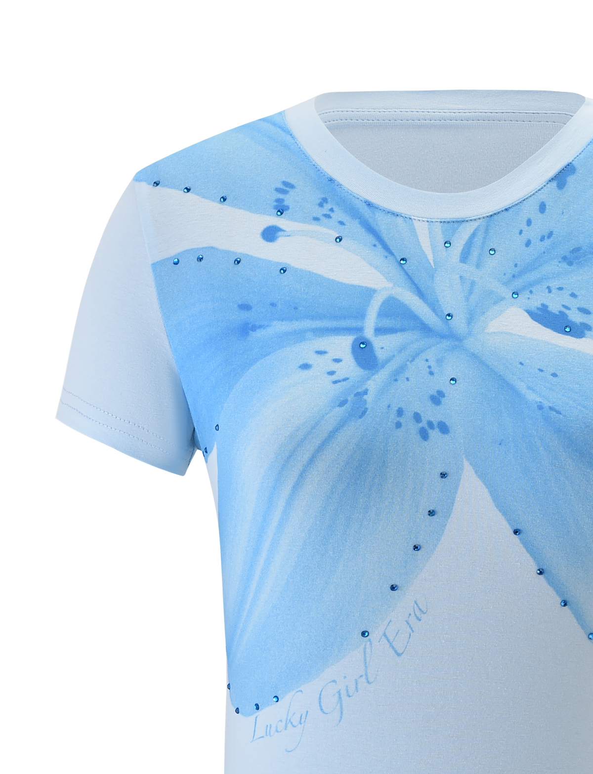 Close-up of the TIGERMIST SAPHIRA TEE - BLUE, featuring a bold blue lily graphic with decorative gems and "Lucky Girl Era" printed at the bottom.
