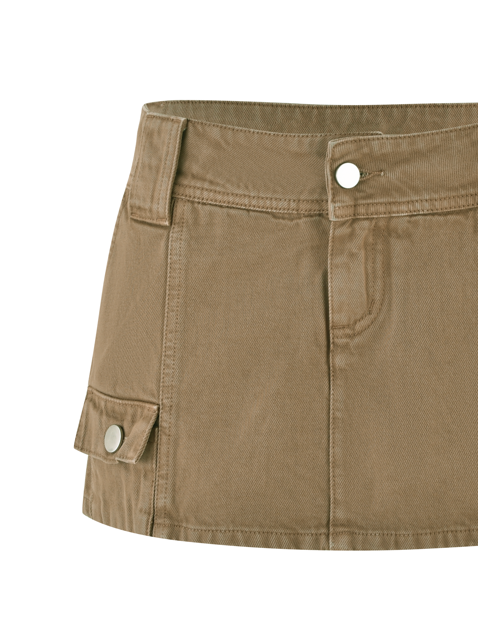 A close-up of the TIGERMIST ZELIE MINI SKORT in washed tan, featuring a wide waistband, front button and zipper, belt loops, and a flap side pocket with snap button for added functionality.
