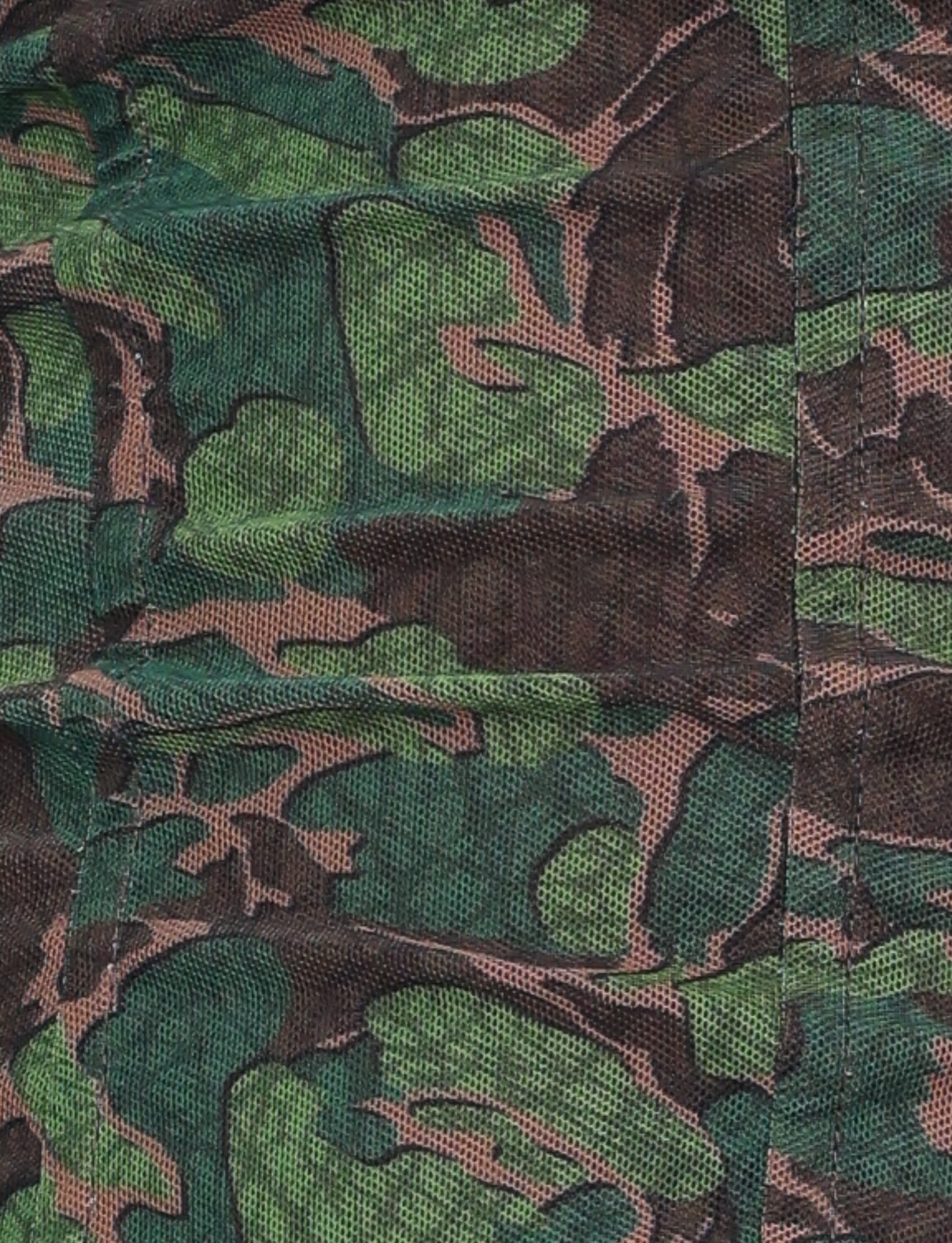 Close-up of the TIGERMIST DULCE CORSET - GREEN : CAMO, featuring green, brown, and black camouflage fabric with visible stitching and textured weave—perfect for a uniquely shaped bust.