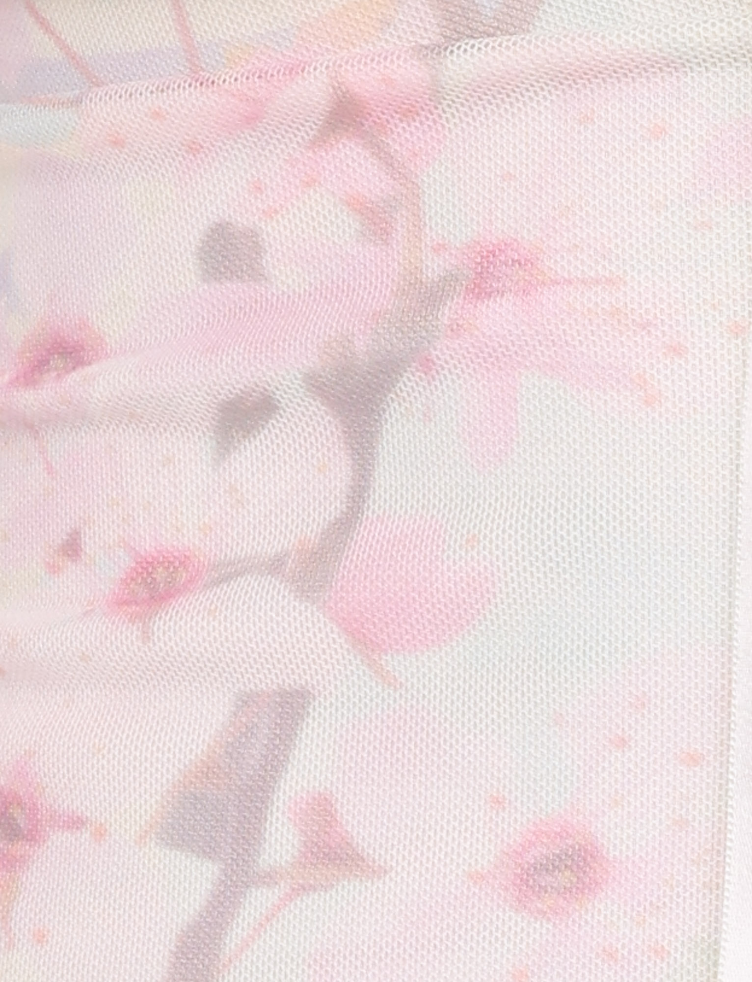Close-up of the LONIE TOP by TIGERMIST in Washed Cherry Blossom: neutral, floral mesh with delicate cherry blossom print and branches in soft pastel shades for a gentle, airy look.