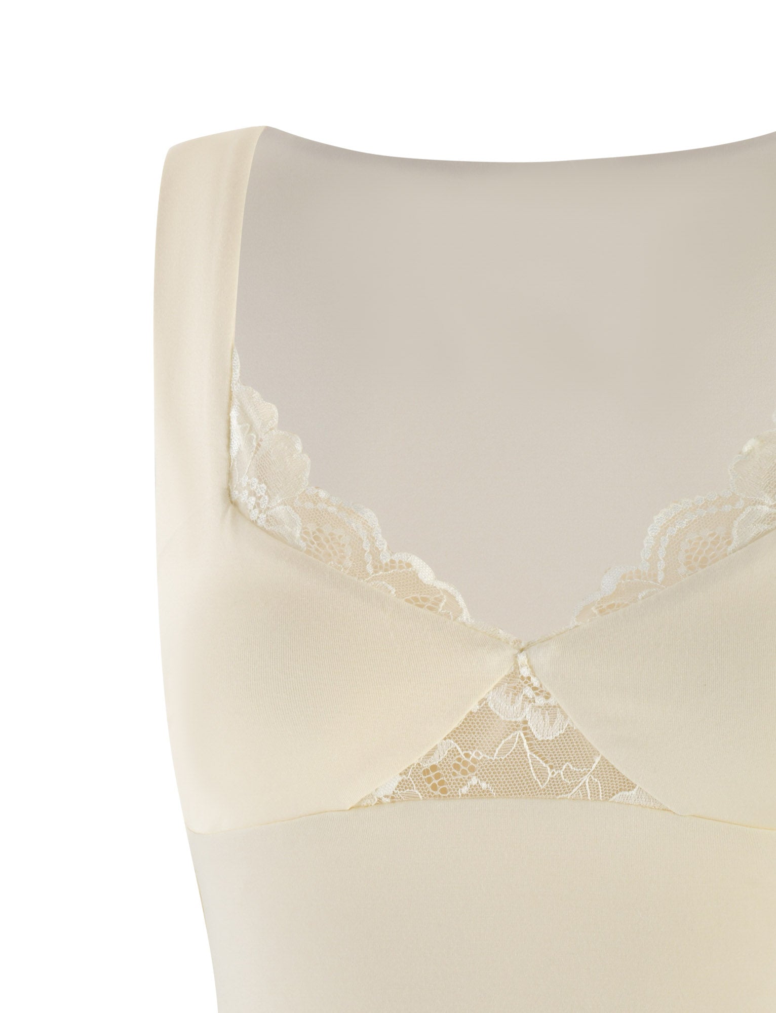 Close-up of the DIONE LACE TOP by TIGERMIST in a soft butter-yellow color, featuring a sleeveless design with floral lace trim near the neckline. The jersey-like fabric appears smooth against a neutral backdrop.