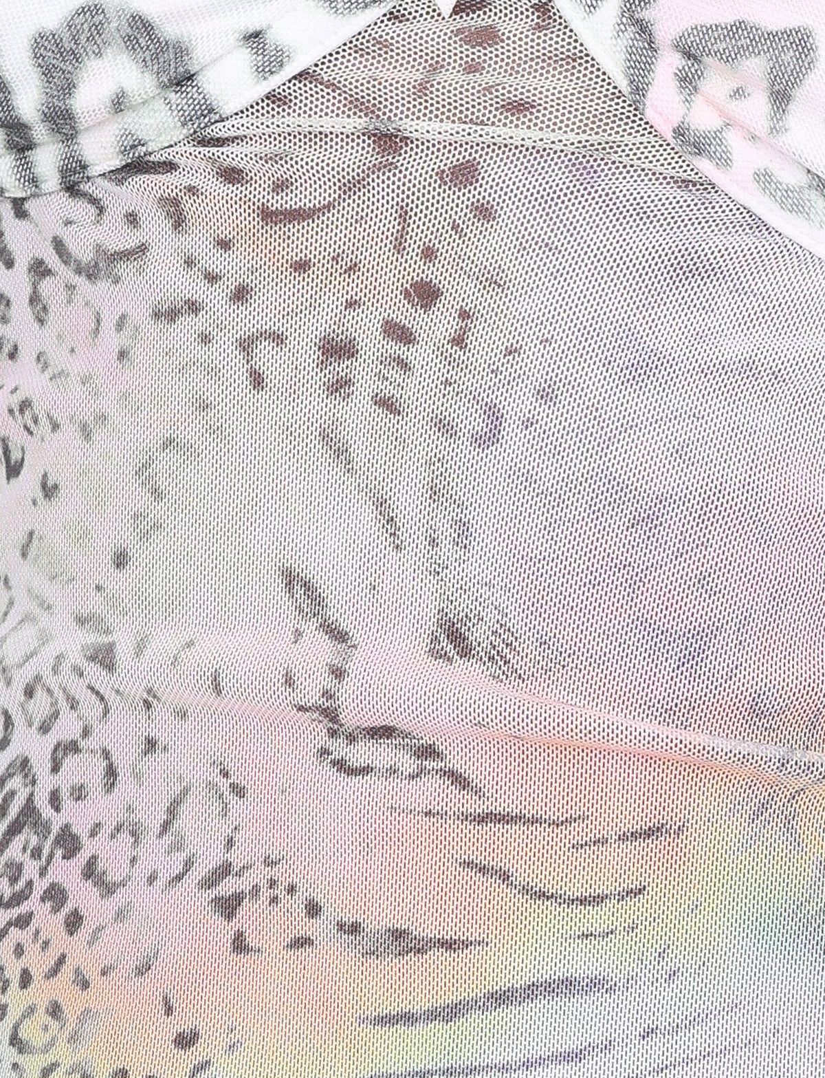 Close-up of the JOSEPHINE TOP - WHITE by TIGERMIST, featuring sheer mesh with a pastel animal print in pink, purple, yellow, black, and gray—ideal for delicate looks or layered styles.
