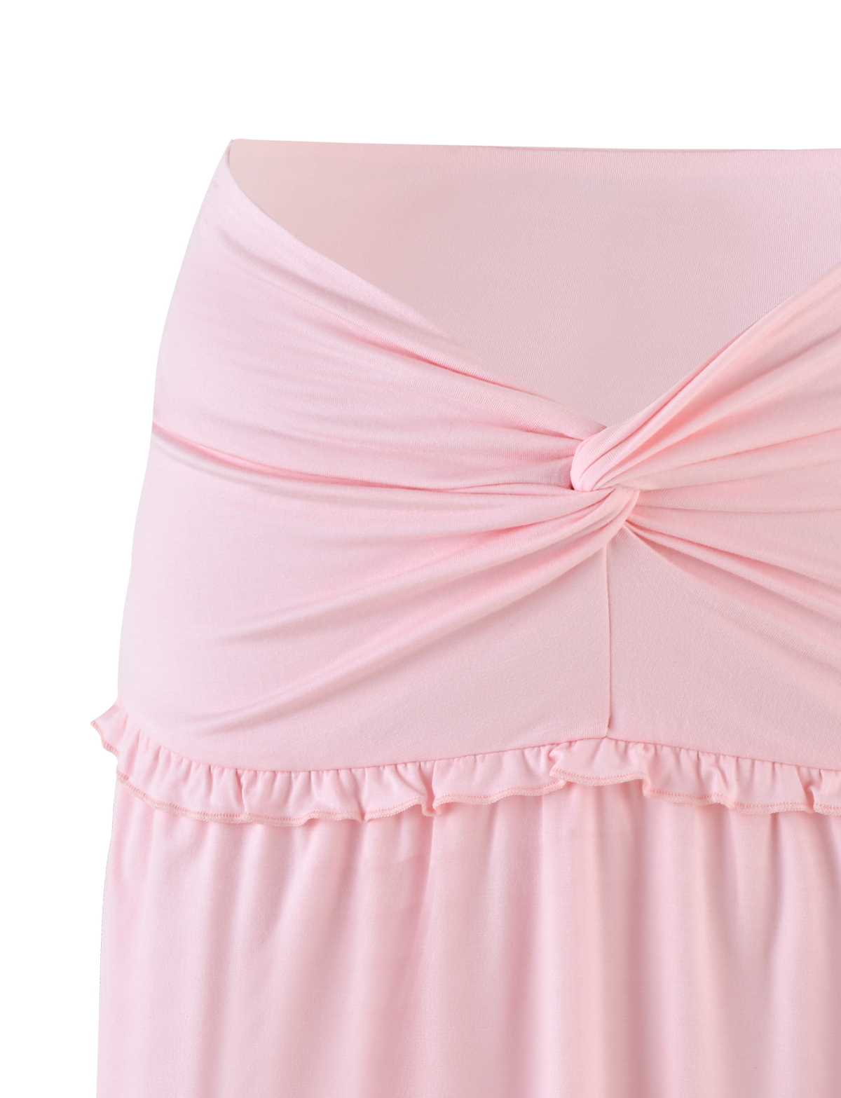 A close-up of the TIGERMIST KATYA MINI SKIRT in pale pink, showcasing a twisted knot at the waist, ruffled hemline, and soft, slightly stretchy buttery jersey fabric for a perfect mini skirt look.