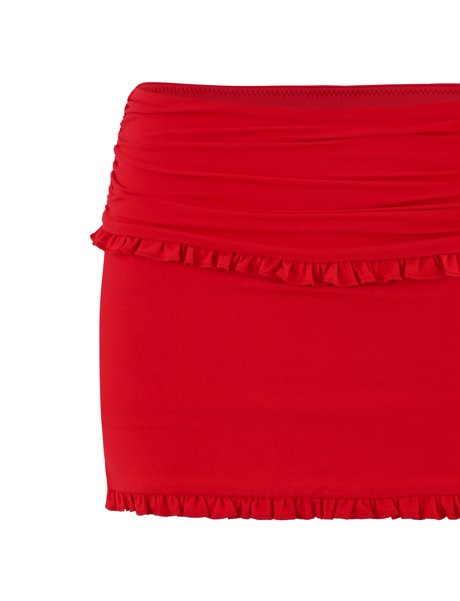 The GINNY SKORT - RED by TIGERMIST features a vibrant red color, playful ruffle details on the hem and top, and a ruched waistband for extra charm.