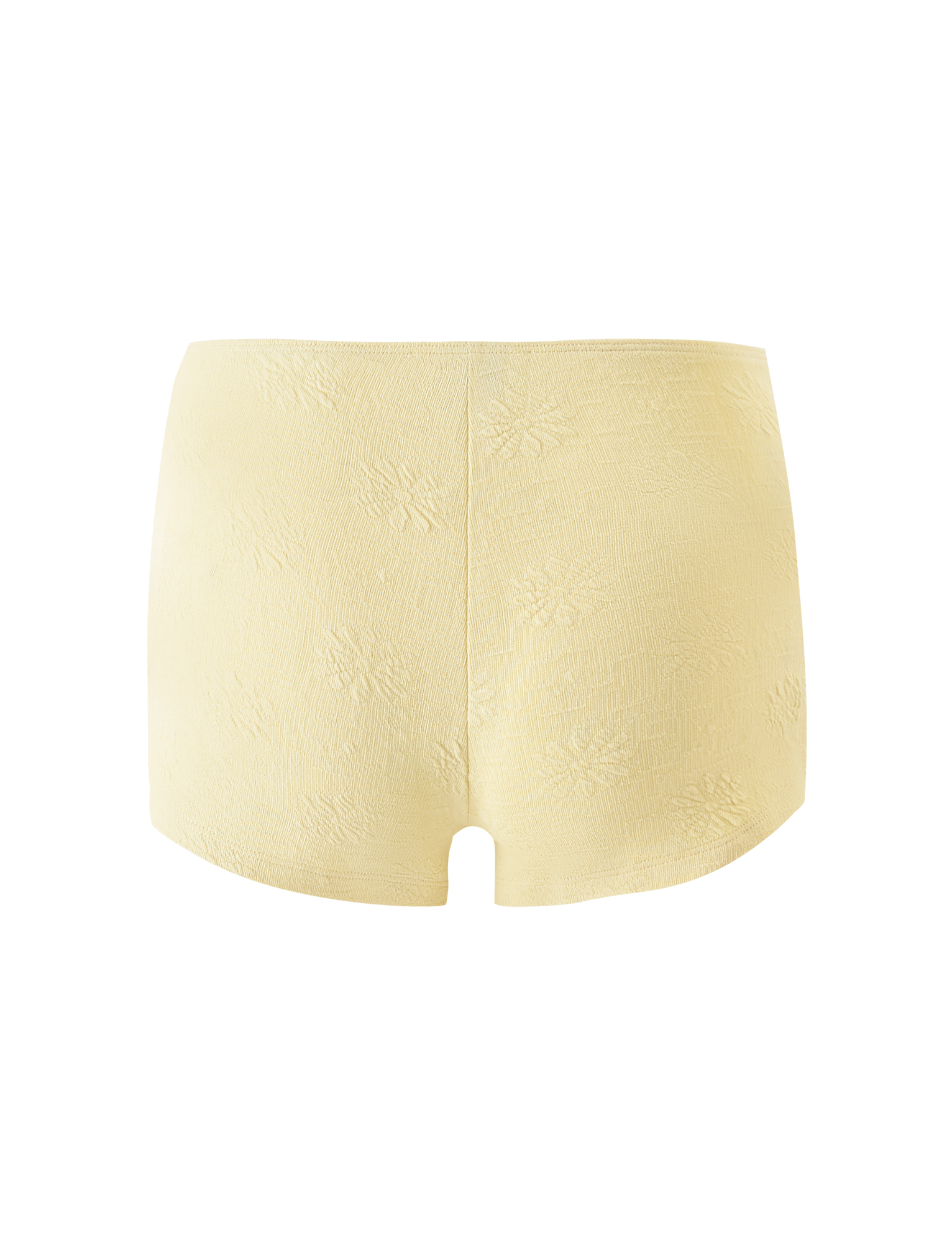 The QUINLAN SHORT - LEMON by TIGERMIST is a pair of high-waisted, pale yellow women's underwear featuring delicate floral details and a subtle pattern, shown from the back against a white background.