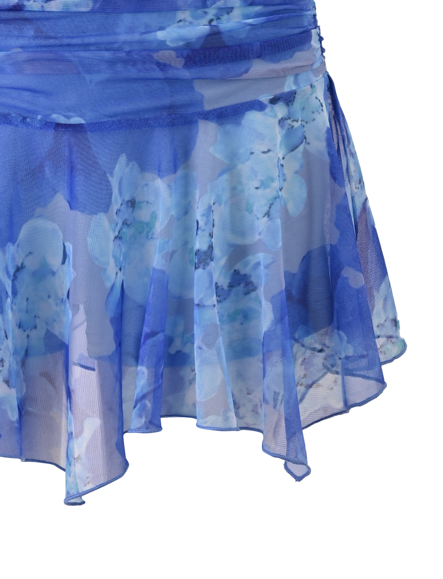 The DEVYN MINI SKORT - BLUE MACRO FLORAL by TIGERMIST is a blue, floral-printed handkerchief mini skort made from lightweight stretch fabric, shown against a white background.