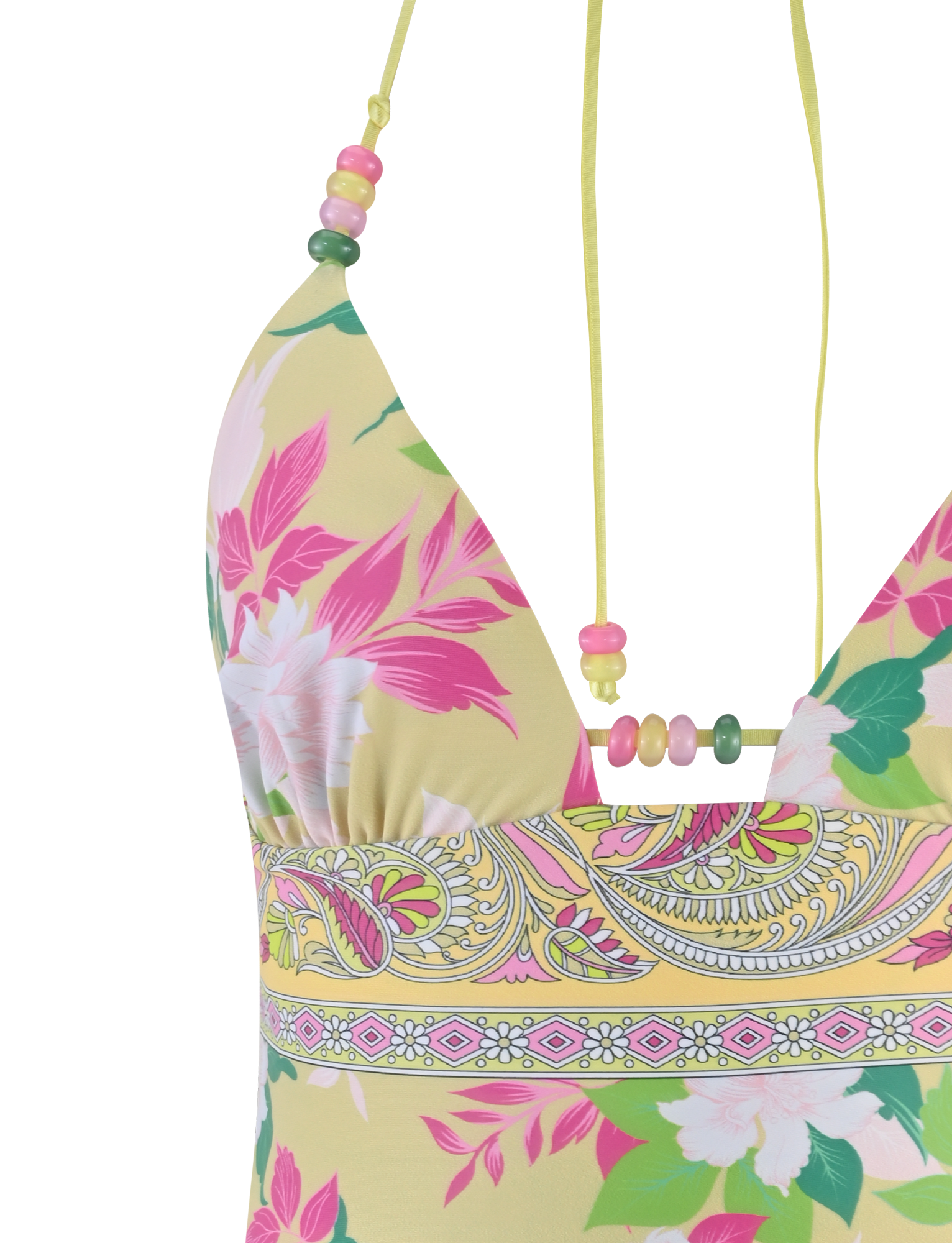 Close-up of the FINLEA TANKINI TOP - PAISLEY BORDER by TIGERMIST, featuring a yellow paisley print with pink, green, and white floral patterns and a halter strap accented with pink, green, and yellow beads.