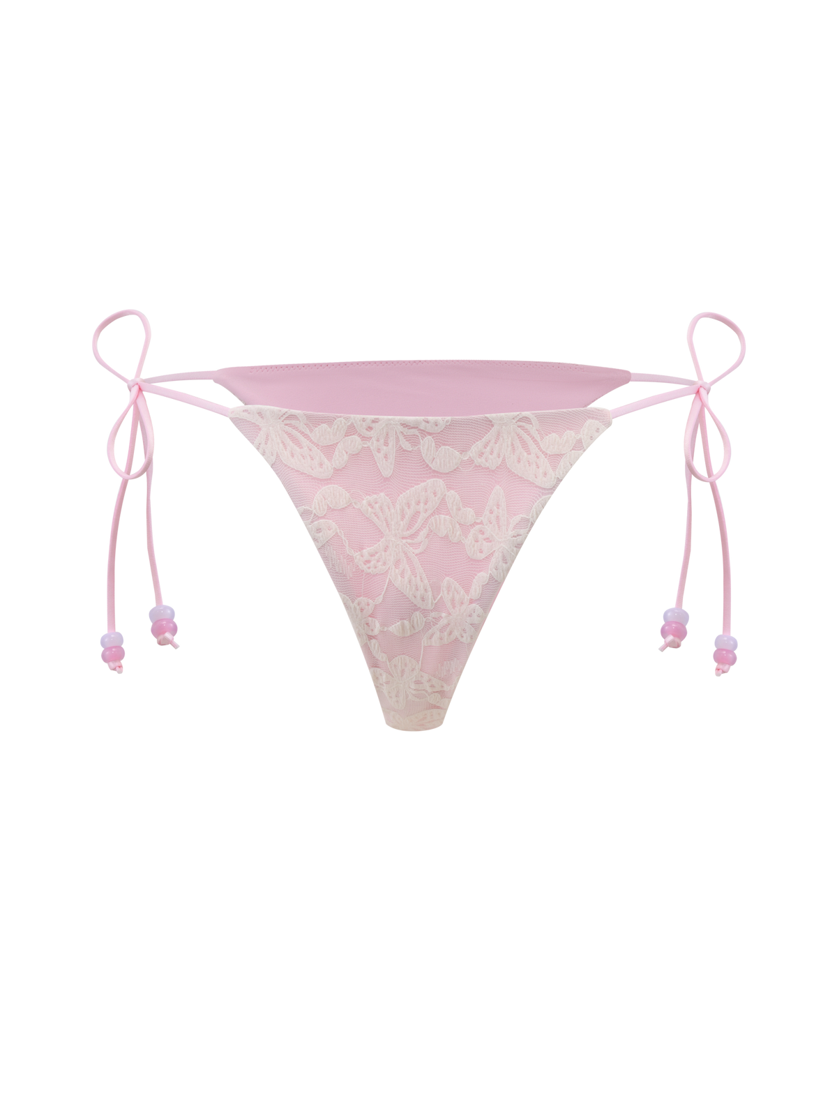 The BRIGITTE BIKINI BOTTOM by TIGERMIST features ivory lace with butterfly patterns and ribbon ties on both sides, showcased against a matching pink background.