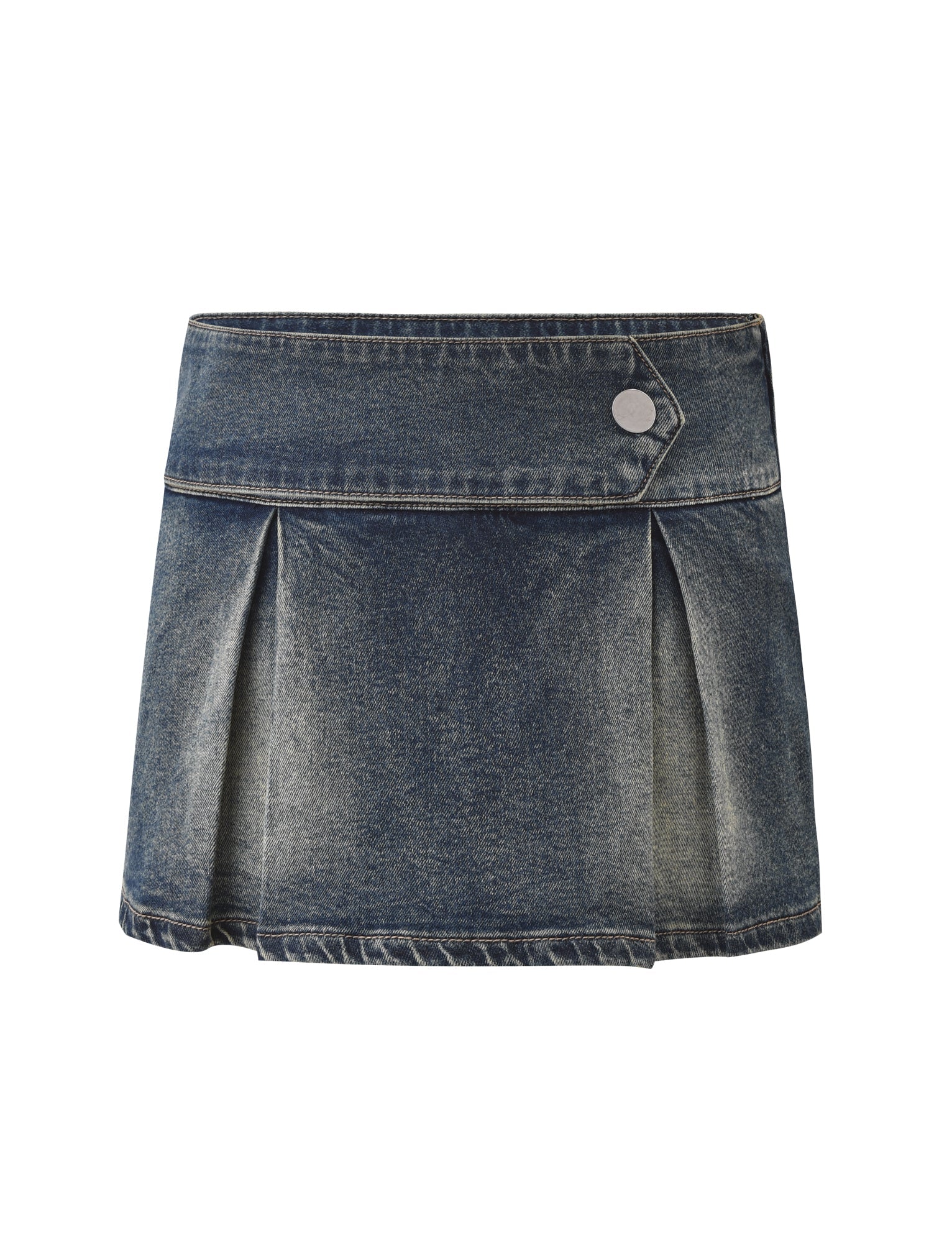 The TIGERMIST LUPITA SKORT - MID WASH is a blue pleated denim mini skort with a wide waistband, built-in shorts, a silver button detail, and a slightly faded finish.